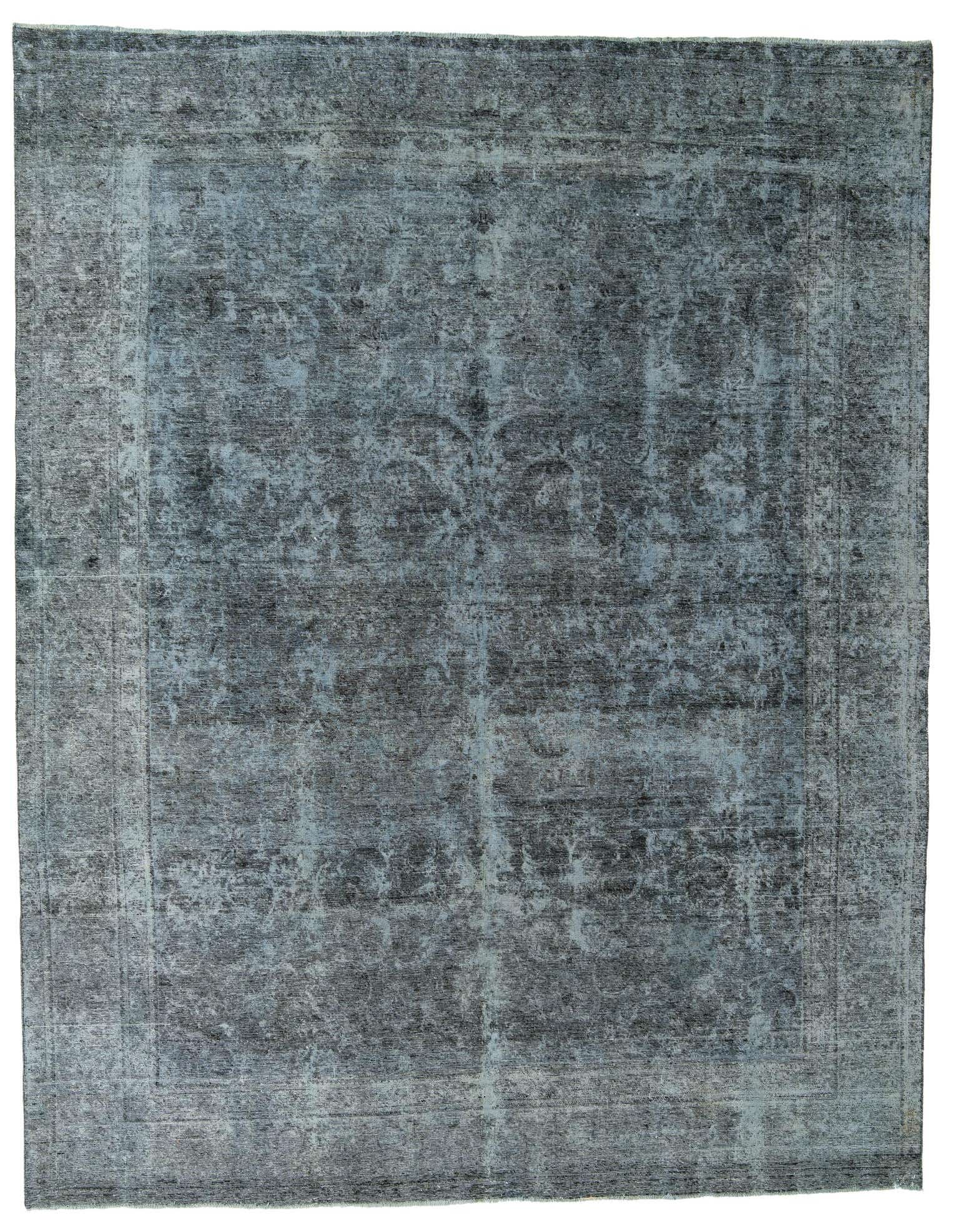 A 10x13 rectangular green Persian rug with a faded vintage pattern and border, suitable for a living room.