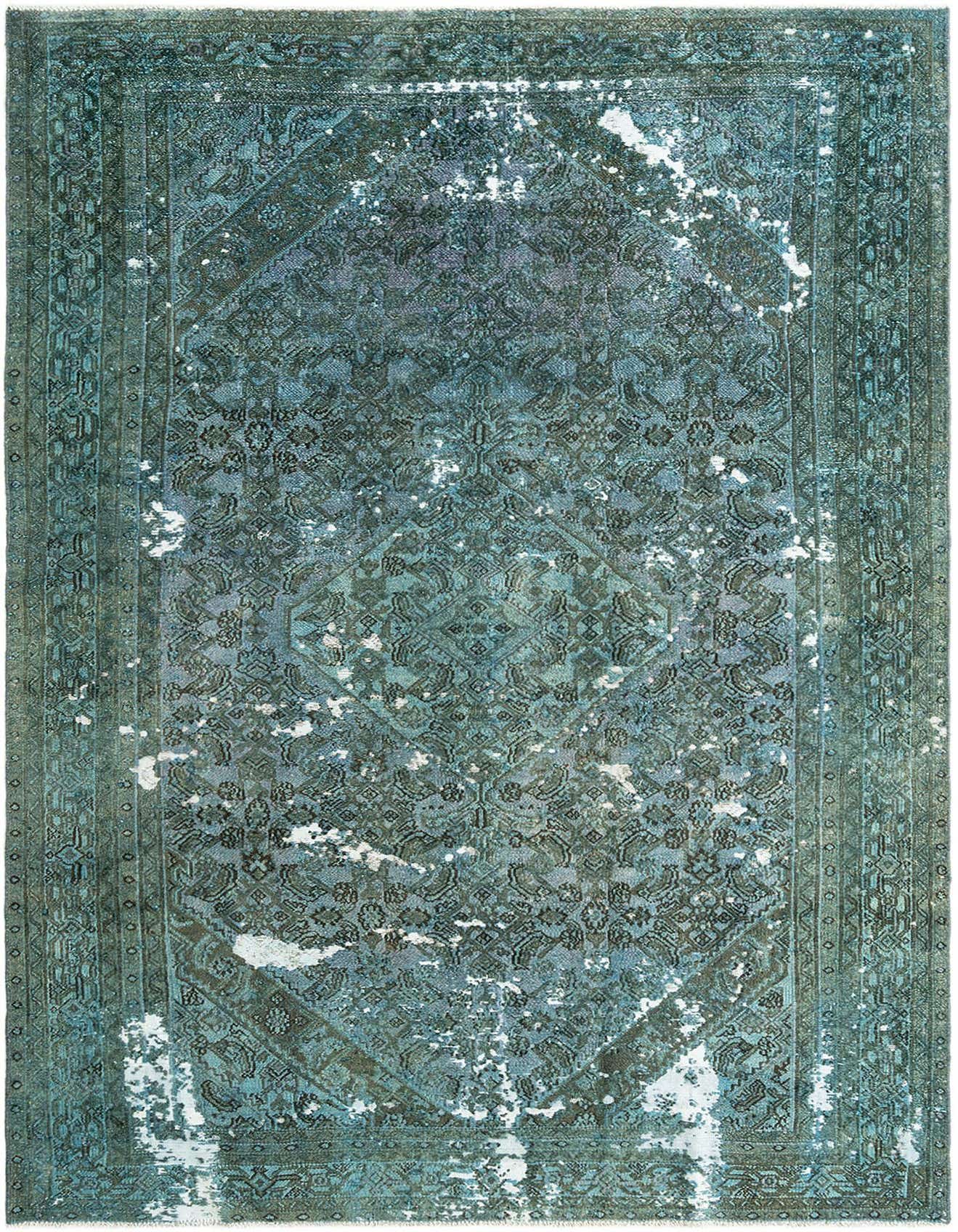 A 6x9 rectangular green vintage wool rug with a distressed traditional pattern, ideal for a living room.