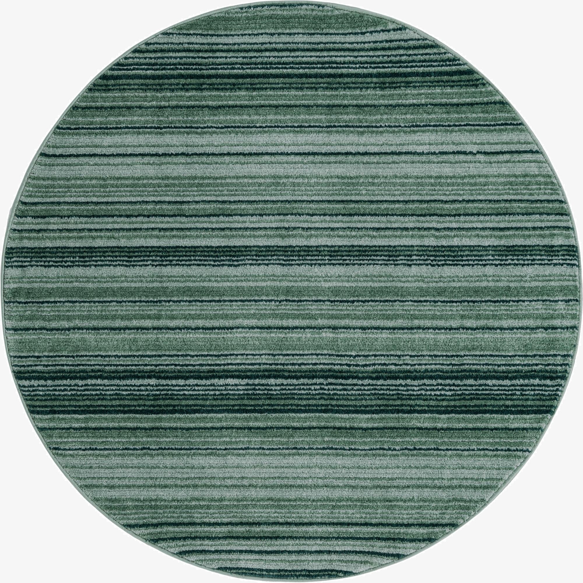 A 5' 3 round green modern rug with varying shades of green horizontal stripes, showcasing its textured pile.