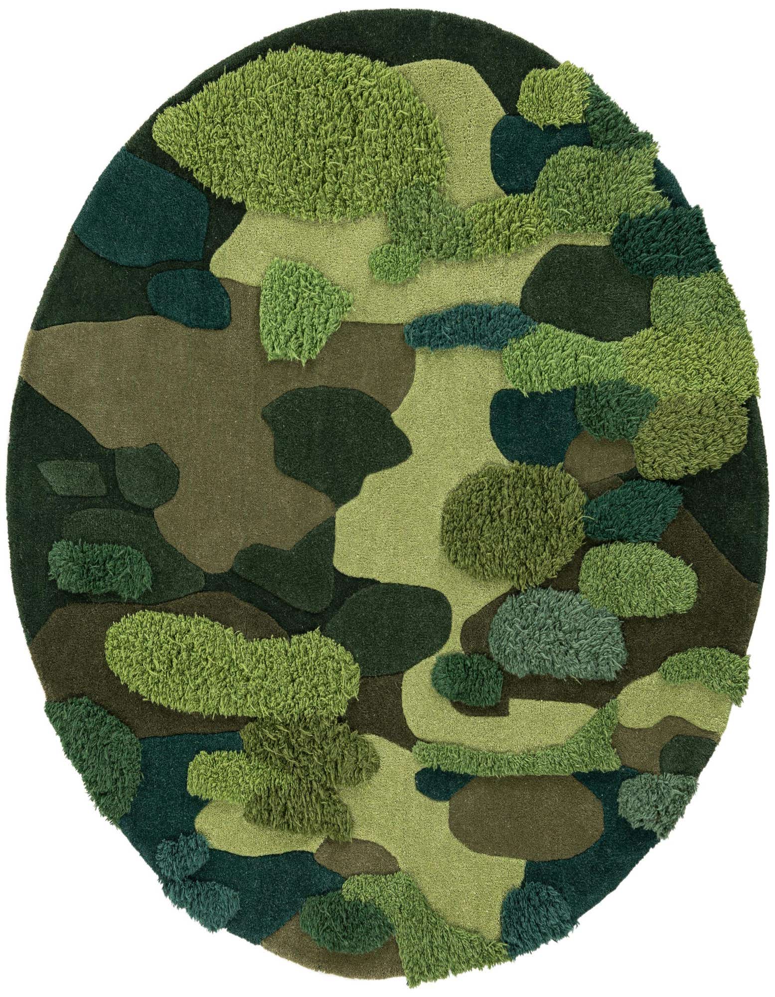 A round green area rug with a modern, abstract moss garden pattern featuring varying shades and textures of green.
