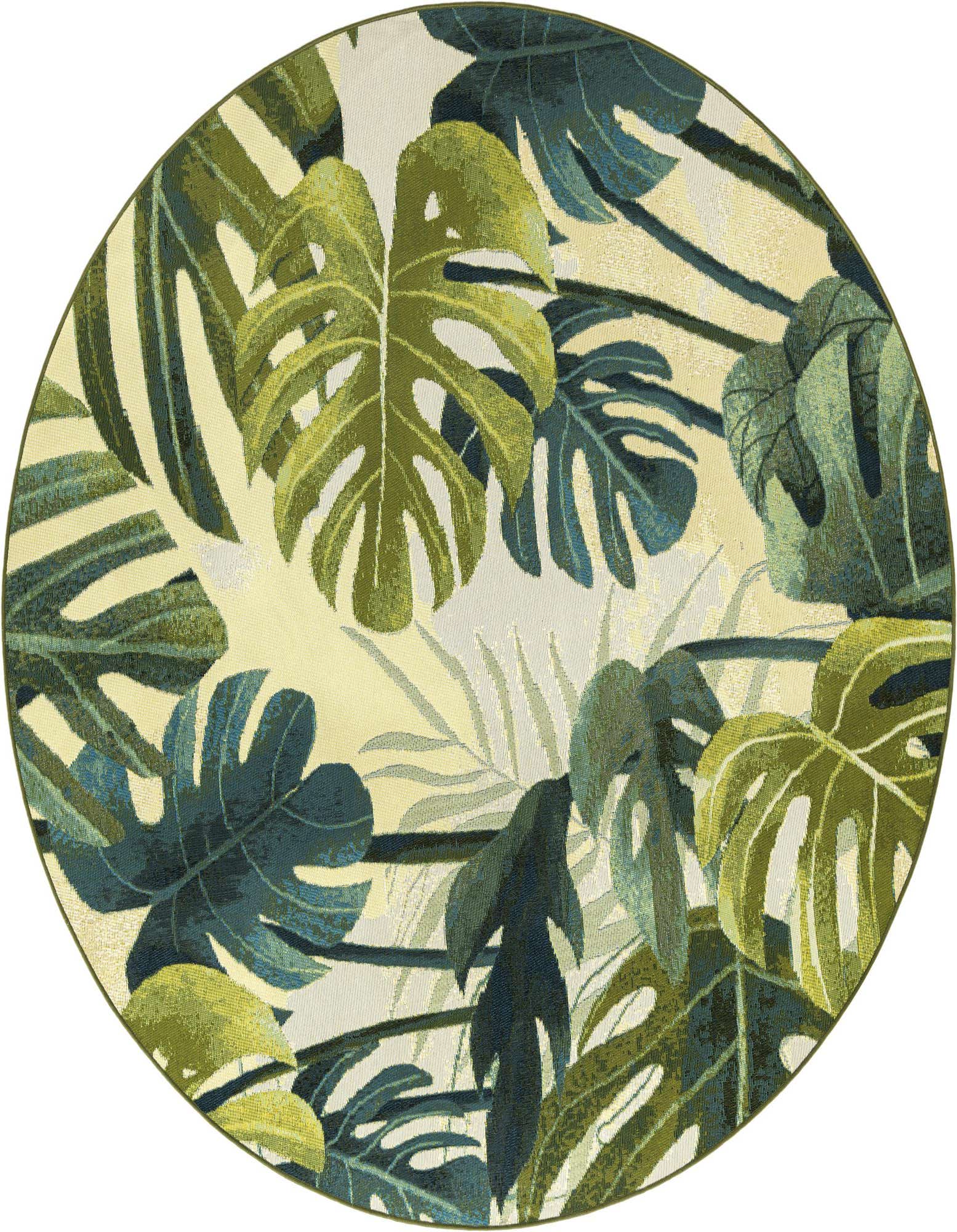 A round green botanical rug featuring large monstera and palm leaves in various shades of green and teal on a cream background.