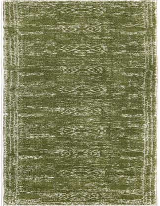 A 13 ft runner rug in shades of green with a distressed, shabby-chic medallion pattern, ideal for a hallway.