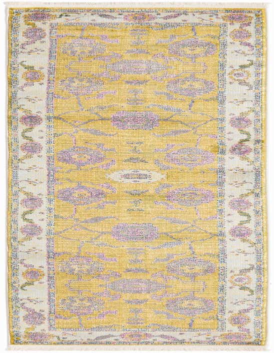 A long 8 ft runner rug featuring a faded green and purple traditional medallion pattern with a light border and fringe.
