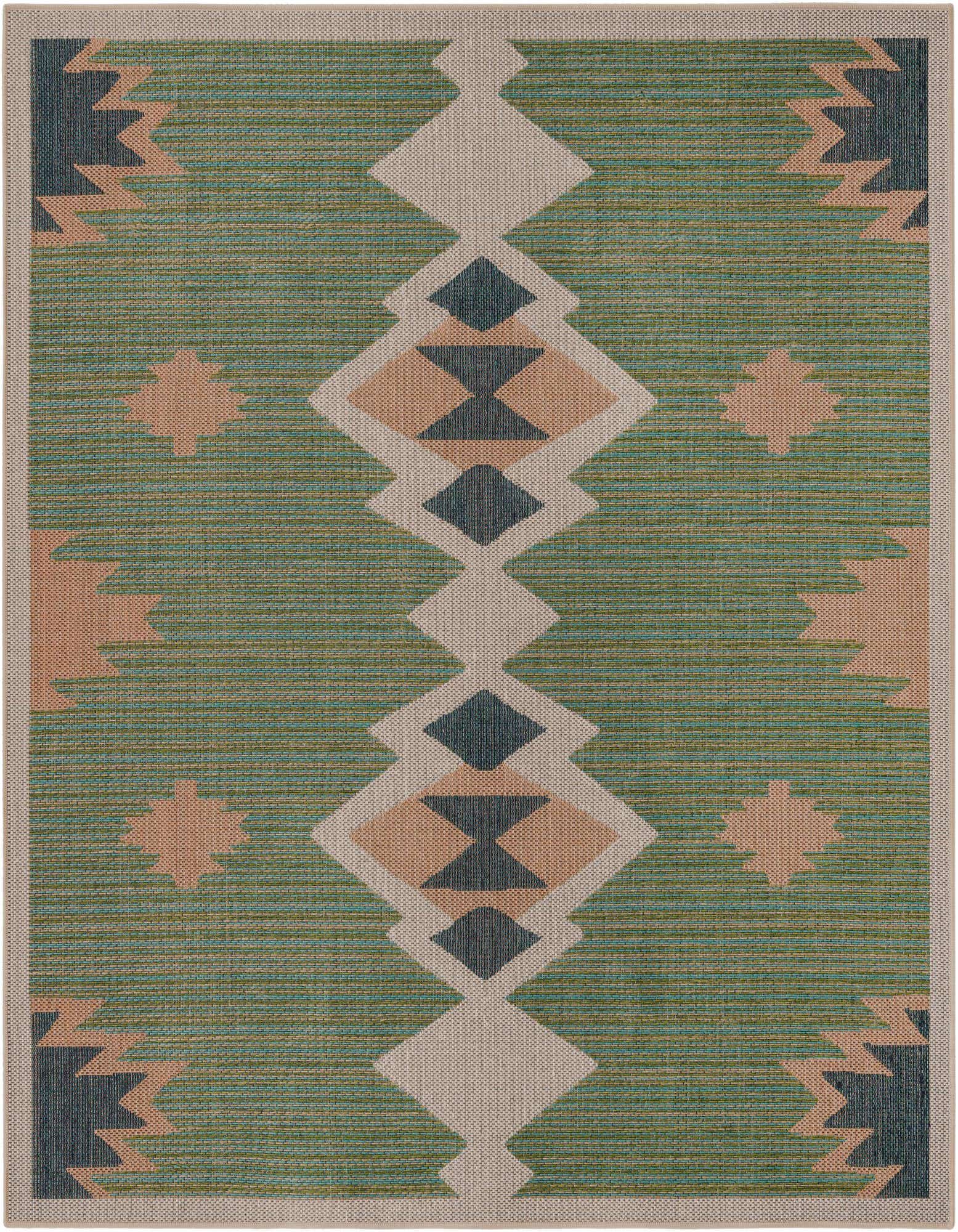 A square green outdoor rug with a central beige and dark green tribal diamond pattern, flanked by abstract peach and dark green shapes.