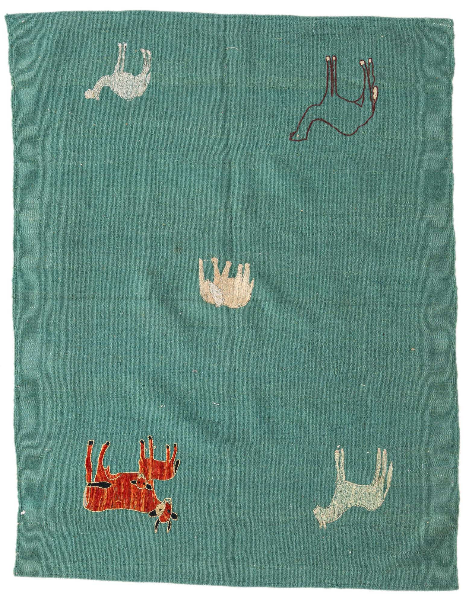 A square green Kilim Suzani rug with a flatweave texture, featuring scattered stylized animal motifs in white, brown, and orange.