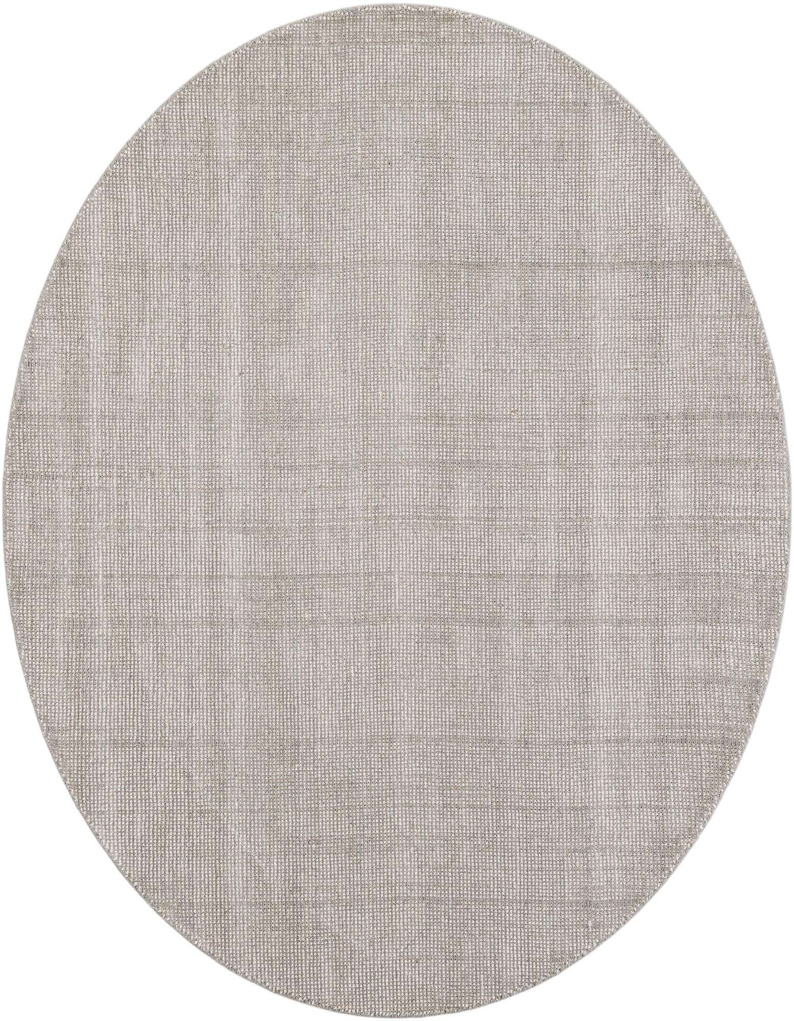 A 6' 1 round gray wool rug with a textured, high pile, showcasing its modern style and eco-friendly design.