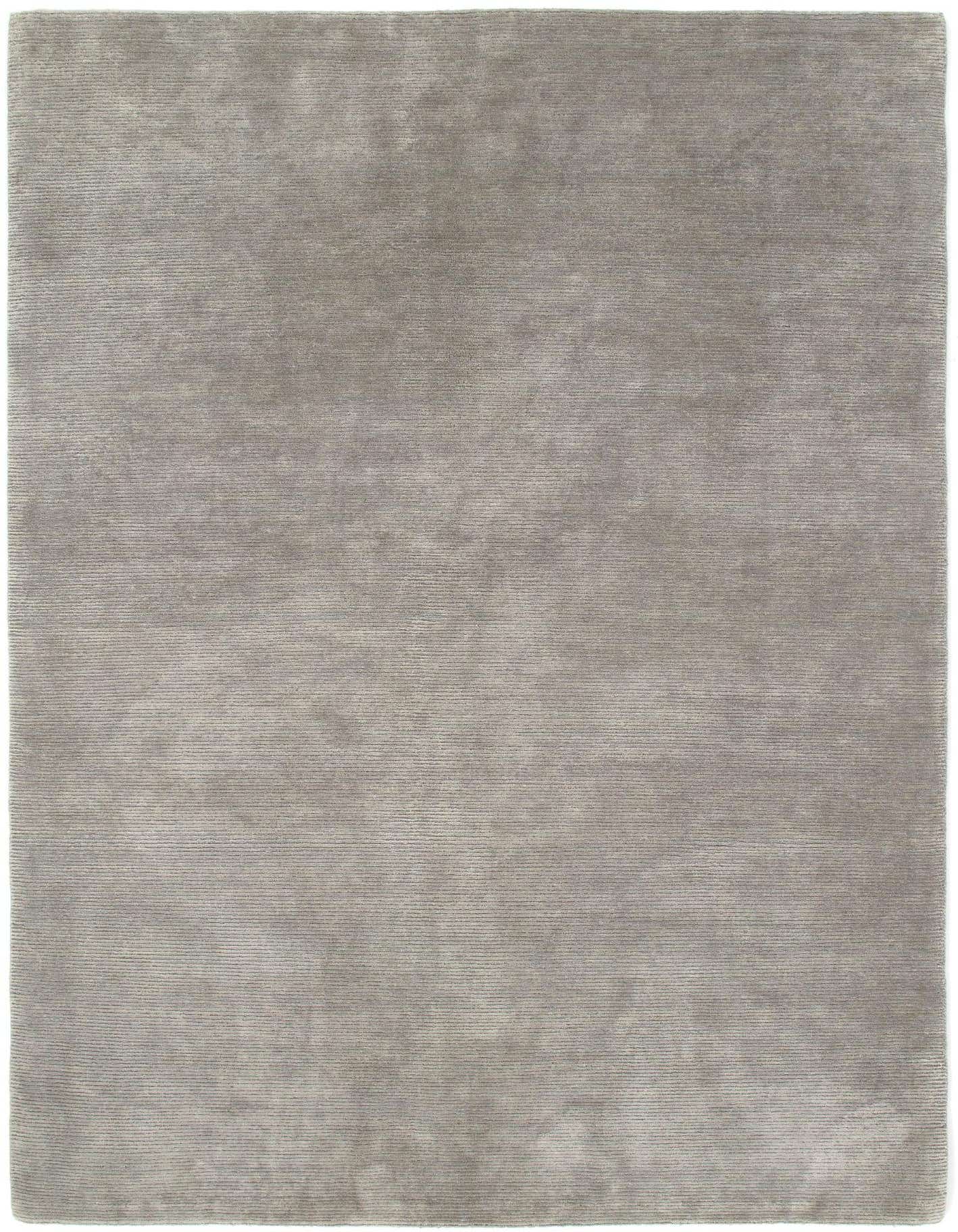 A 4x6 rectangular Nepal Collection rug in a solid grey color with a medium pile, suitable for a living room.