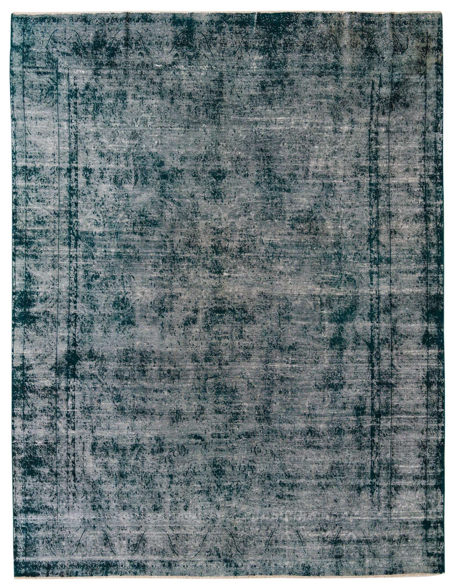 A large 9x12 rectangular green Persian-style area rug with a faded vintage medallion pattern, handmade from wool.