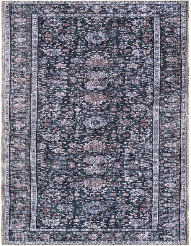 A 6 ft runner rug in Ink Black, featuring a faded traditional floral pattern with hints of blue and rust, perfect for a hallway.