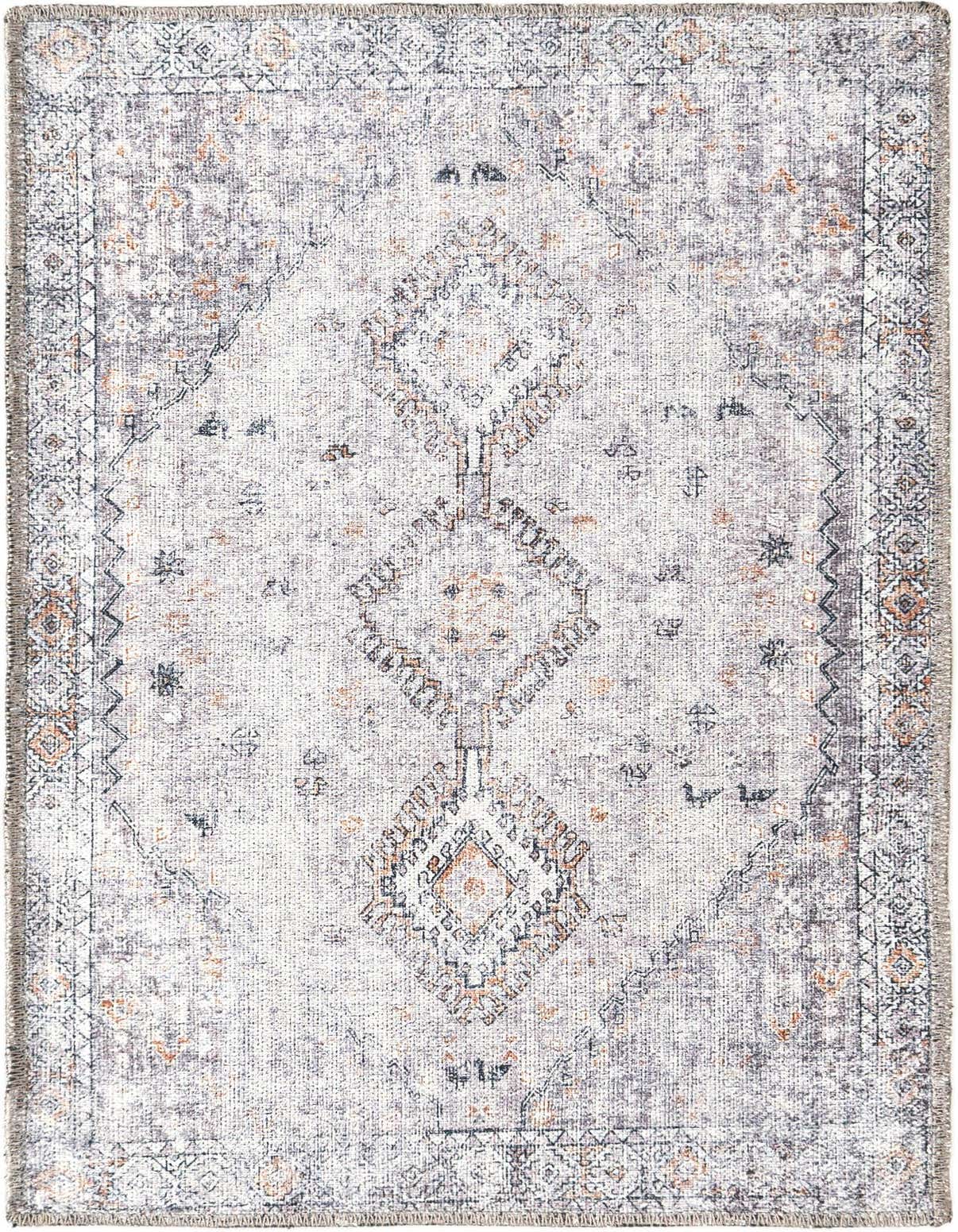 A 2x3 rectangular Rugs.com Yara rug with a distressed tribal pattern in browns, tans, and ivories, perfect for an entryway.