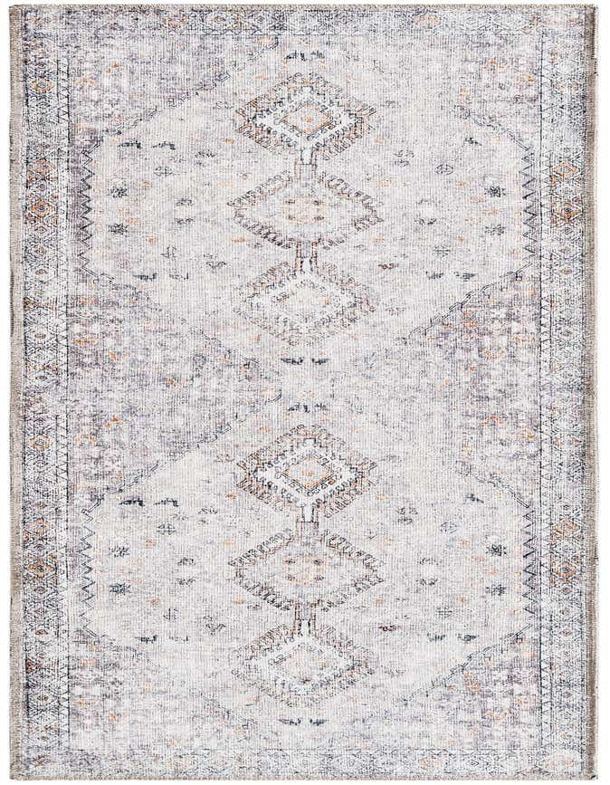 A 6 ft runner rug featuring a distressed tribal pattern in browns, tans, and ivories, ideal for a hallway or kitchen.