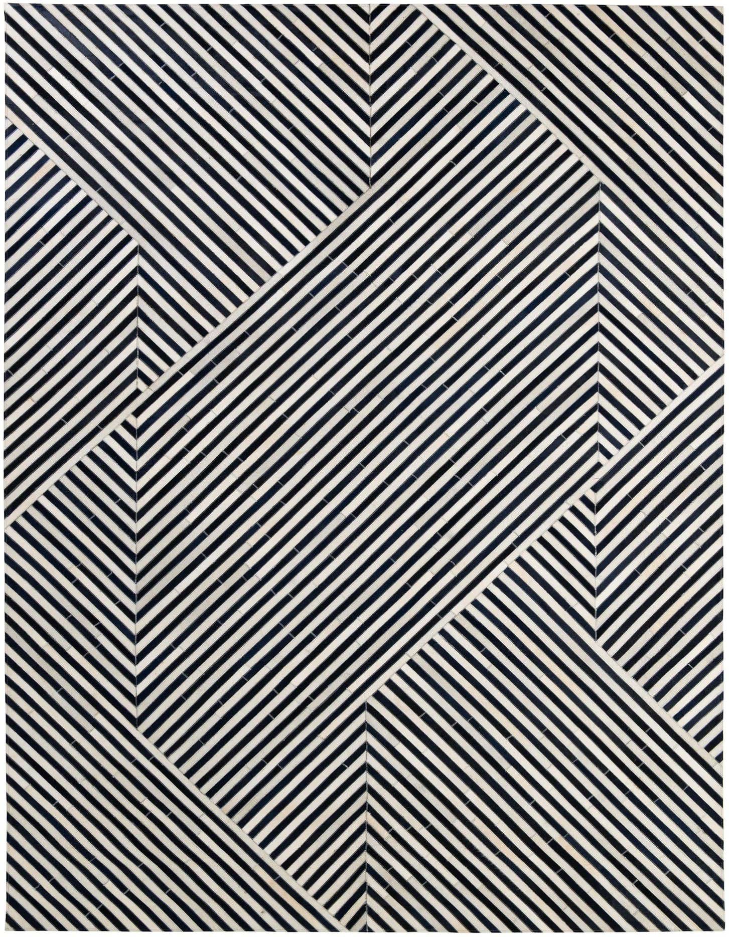 A rectangular 8x11 black and white modern cowhide rug with a dynamic striped geometric pattern, perfect for a living room.