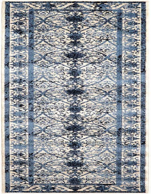 A 10 ft runner rug with a traditional floral pattern in varying shades of blue and cream, ideal for a hallway.