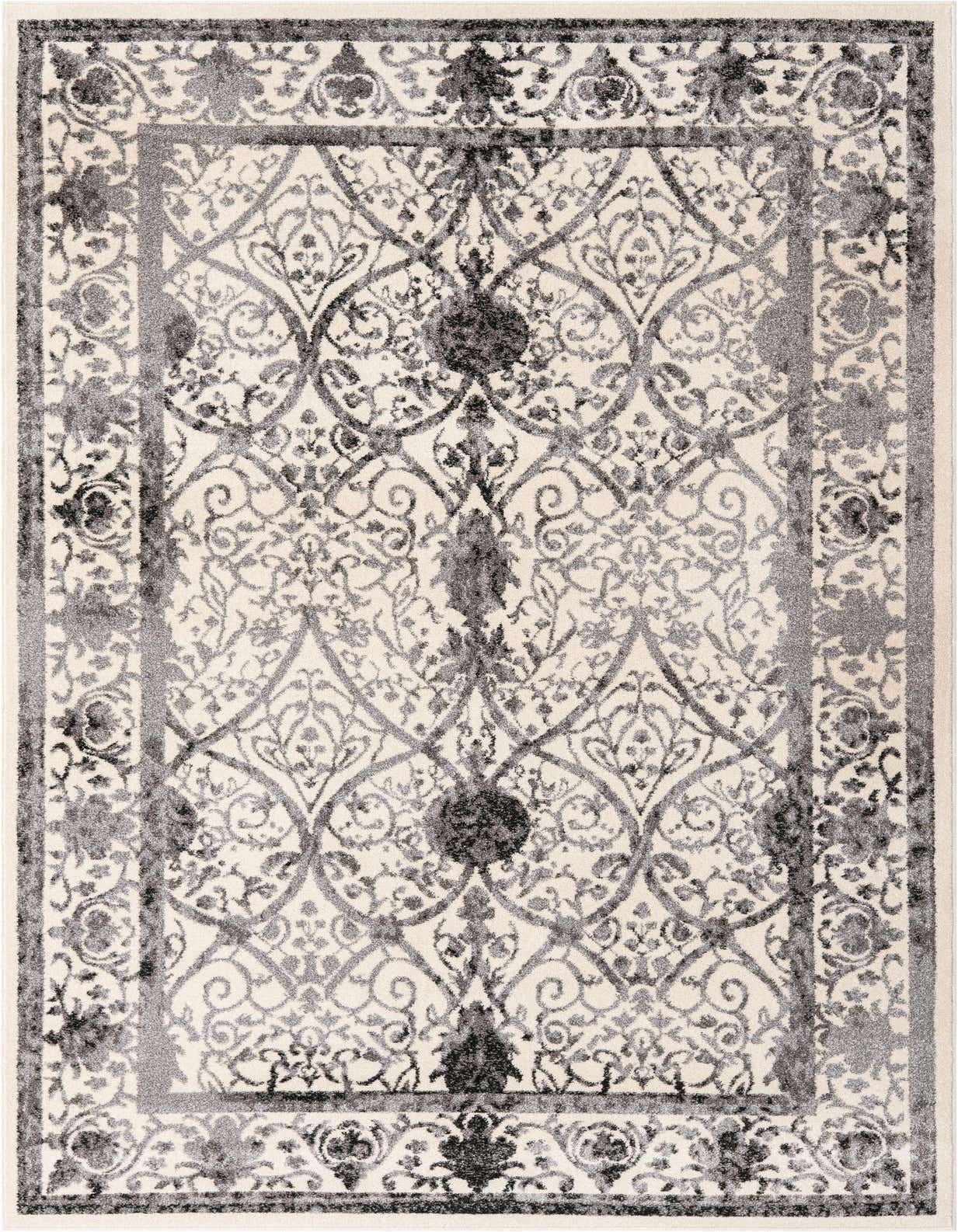 A rectangular 5x8 ivory and gray traditional area rug with an ornate floral and botanical pattern and a distressed look.