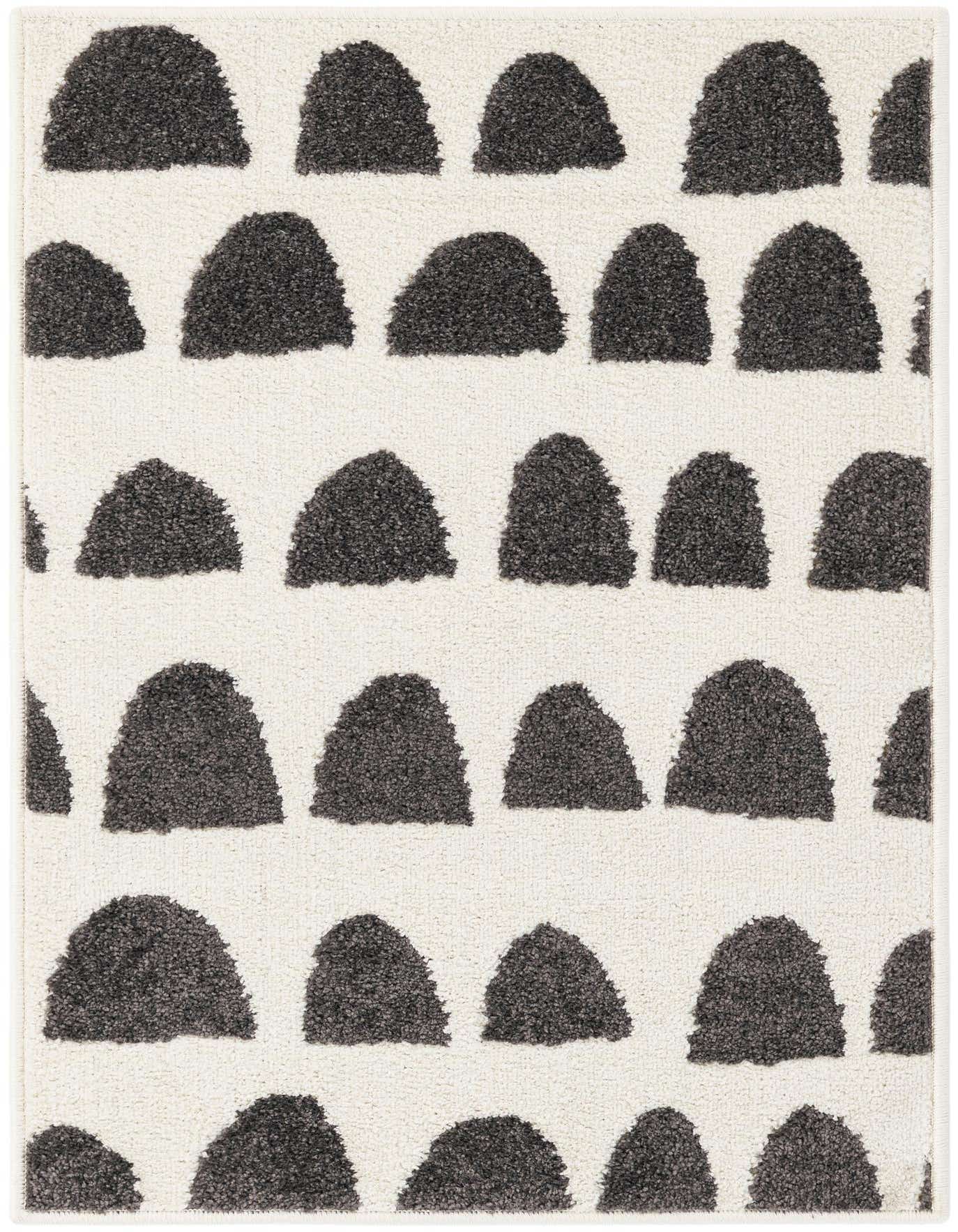 A 2x3 rectangular ivory rug with a modern abstract pattern of charcoal gray half-circle shapes, perfect for an entryway.