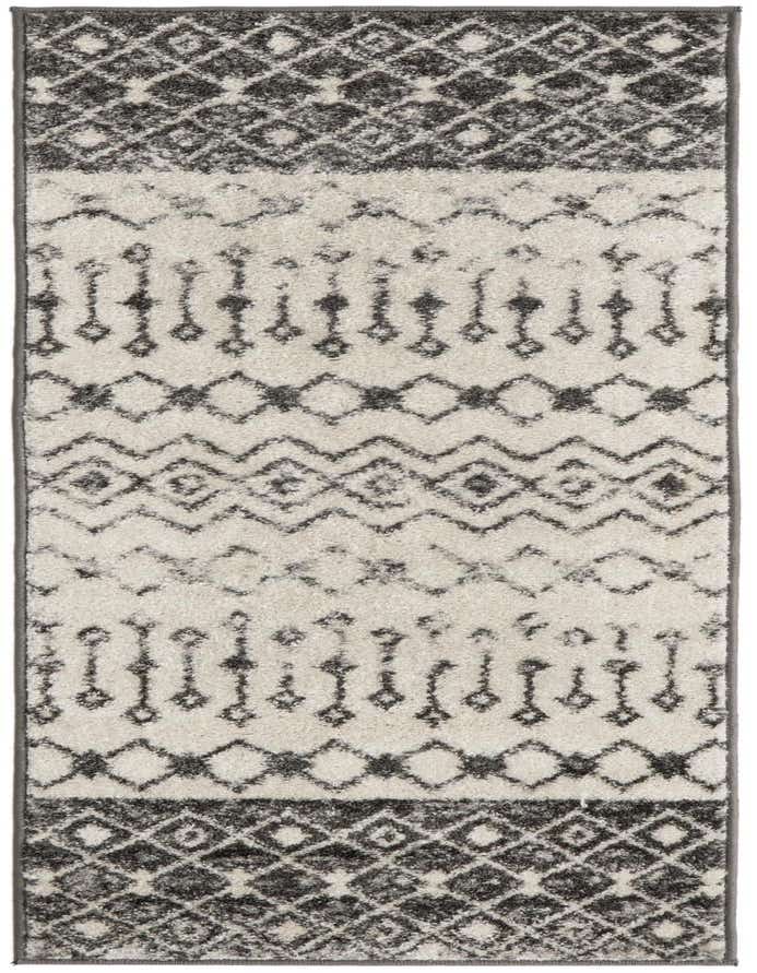 A 6 ft runner rug with a cream background and gray tribal patterns, perfect for a hallway or kitchen.