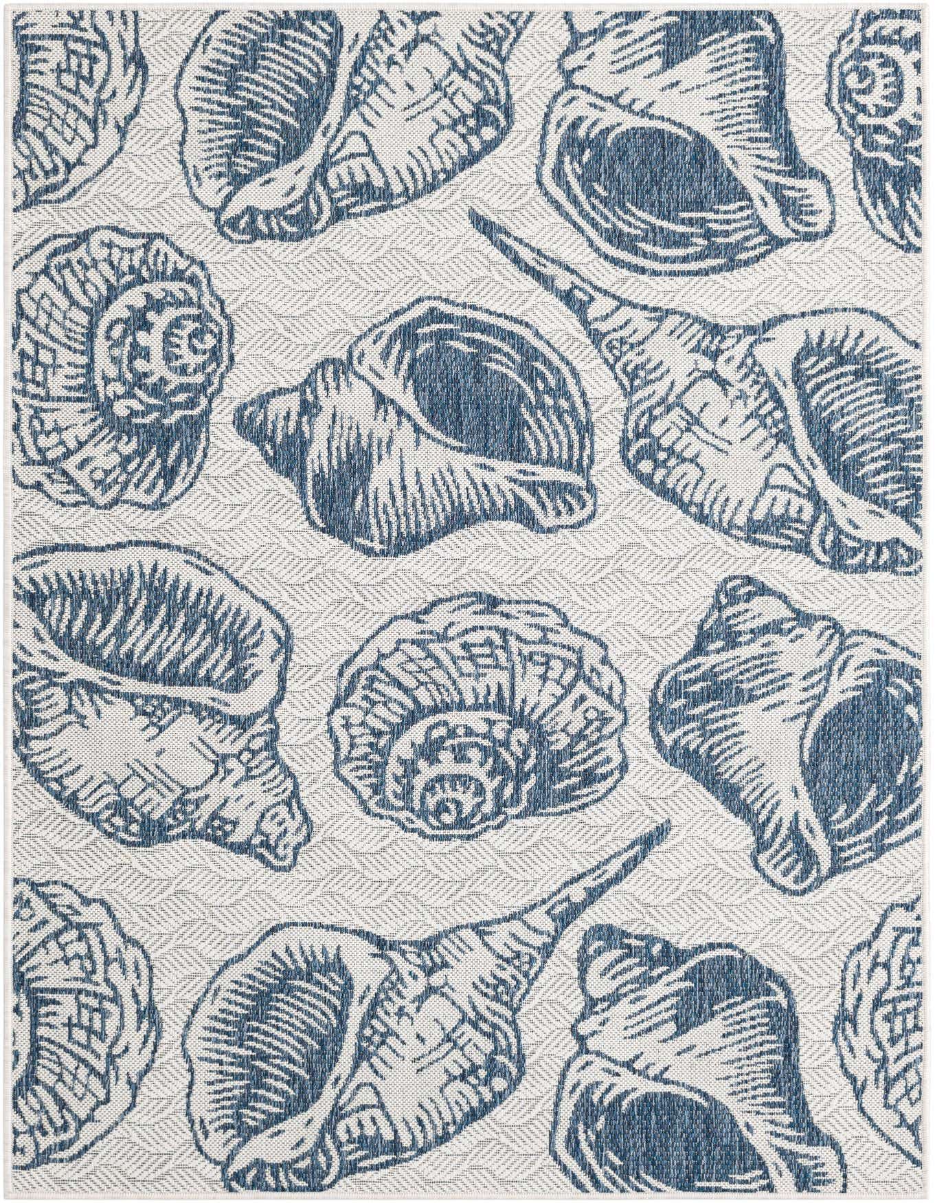 A 4x6 rectangular indoor/outdoor rug with a modern coastal pattern of various blue seashells on an ivory and cream background.
