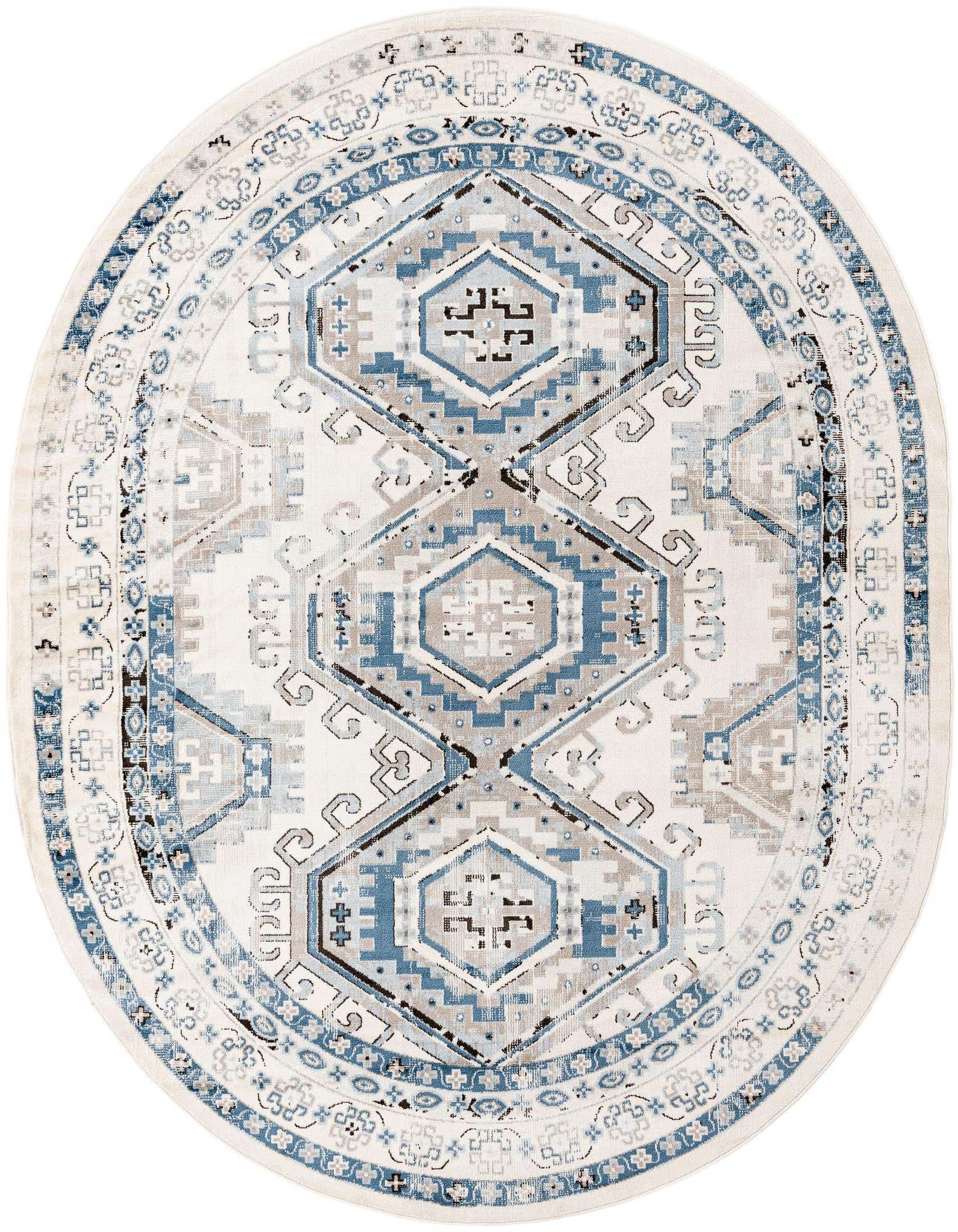 An oval Rugs.com Charlotte rug, 7'10" x 10'0", featuring a traditional tribal pattern in various shades of blue, ivory, and cream.