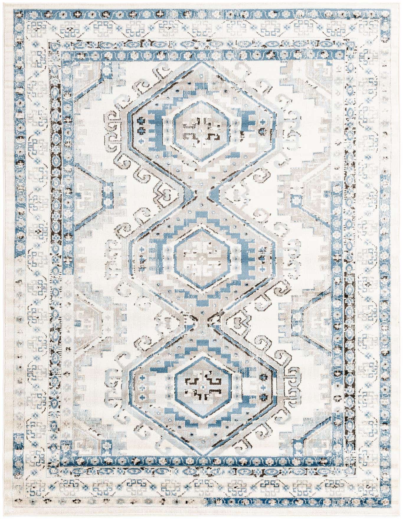 A 6x9 rectangular Rugs.com Charlotte rug featuring a traditional tribal pattern in blues, ivories, and creams.