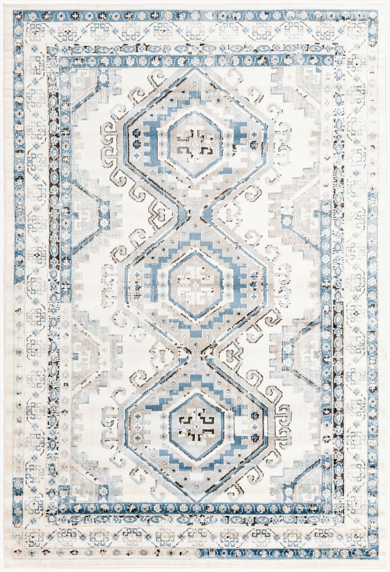 A 6x9 rectangular Rugs.com Charlotte rug featuring a traditional tribal pattern in blues, ivories, and creams.
