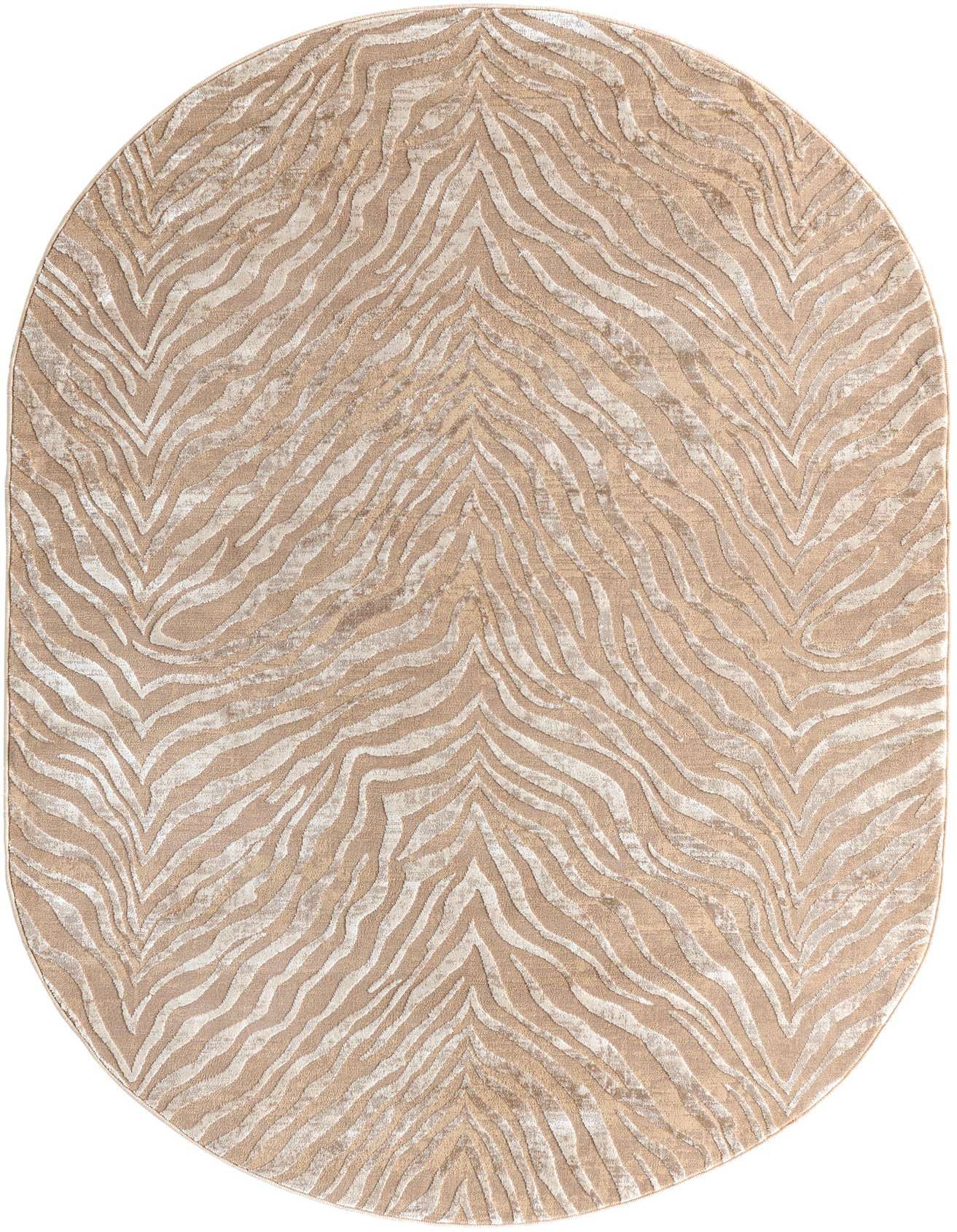 An oval 5'3" x 8'0" Finsbury rug featuring a modern zebra stripe pattern in shades of brown, tan, and ivory.