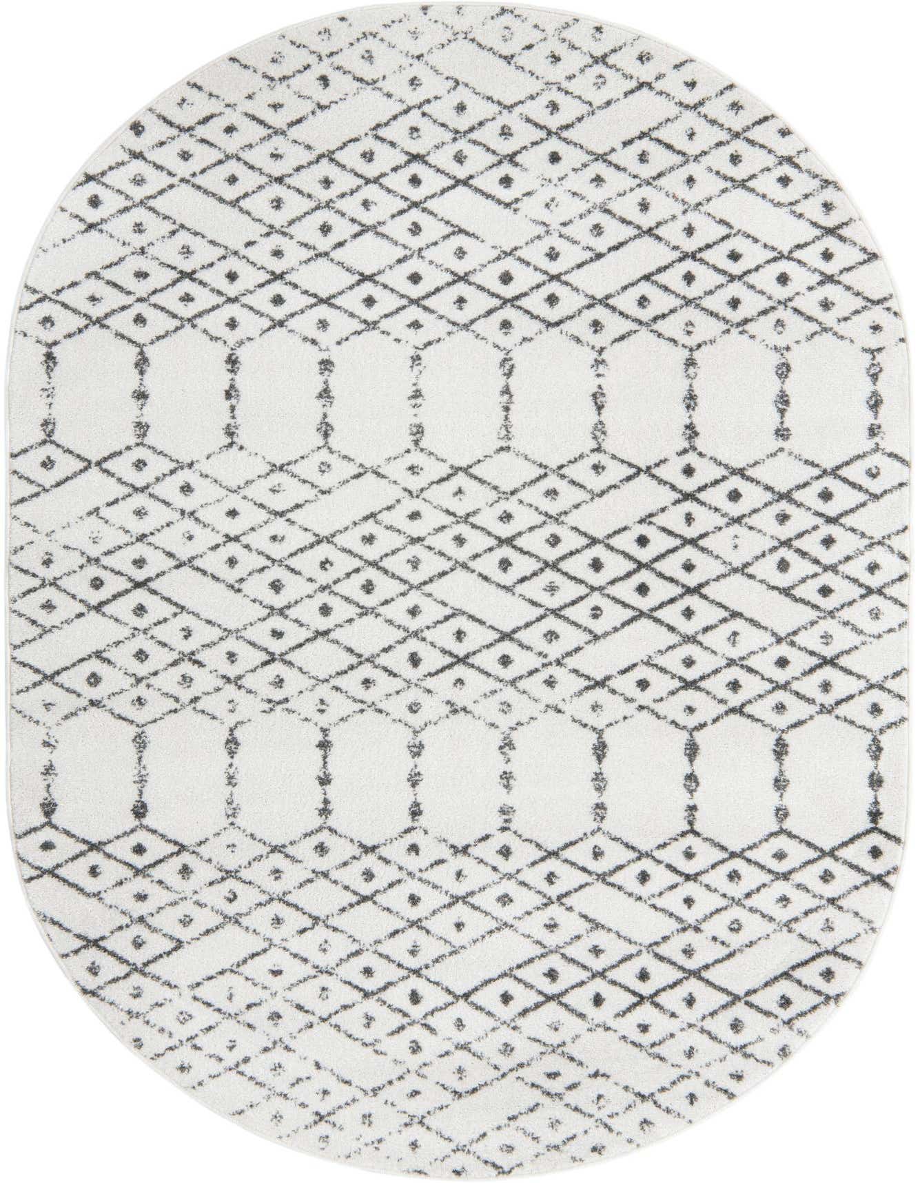 An oval 5'3" x 8'0" ivory rug with a black tribal trellis pattern, suitable for modern indoor spaces.