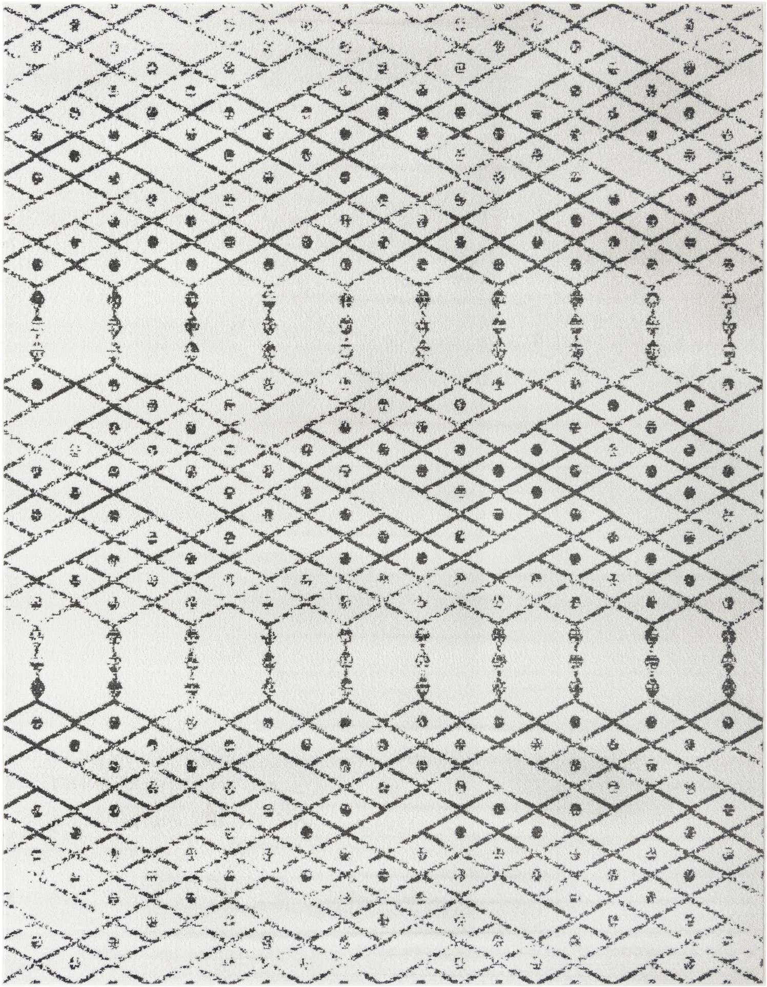 A 9x12 rectangular ivory and black Paxon Trellis rug featuring a distressed tribal diamond and dot pattern.