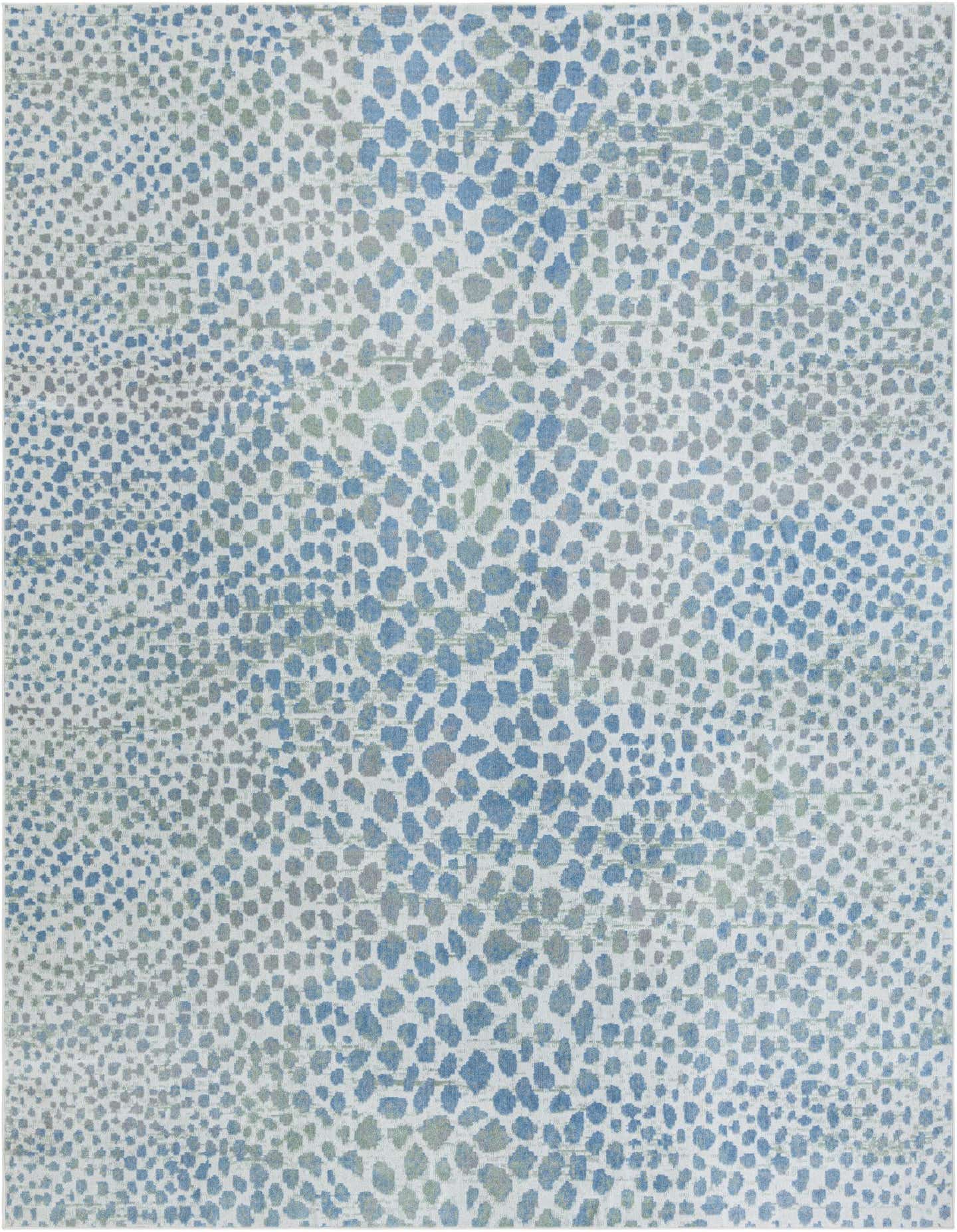 A 10x14 rectangular Kamala Washable rug featuring an abstract pattern of blue and ivory spots on a white background.