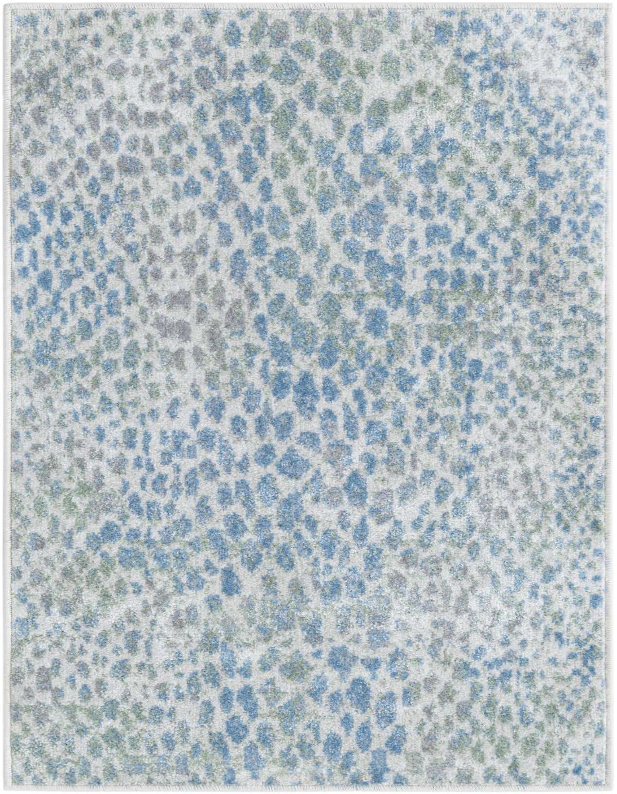 A 2x3 rectangular Kamala Washable rug featuring an abstract pattern of blue, ivory, and cream speckles on a light background.