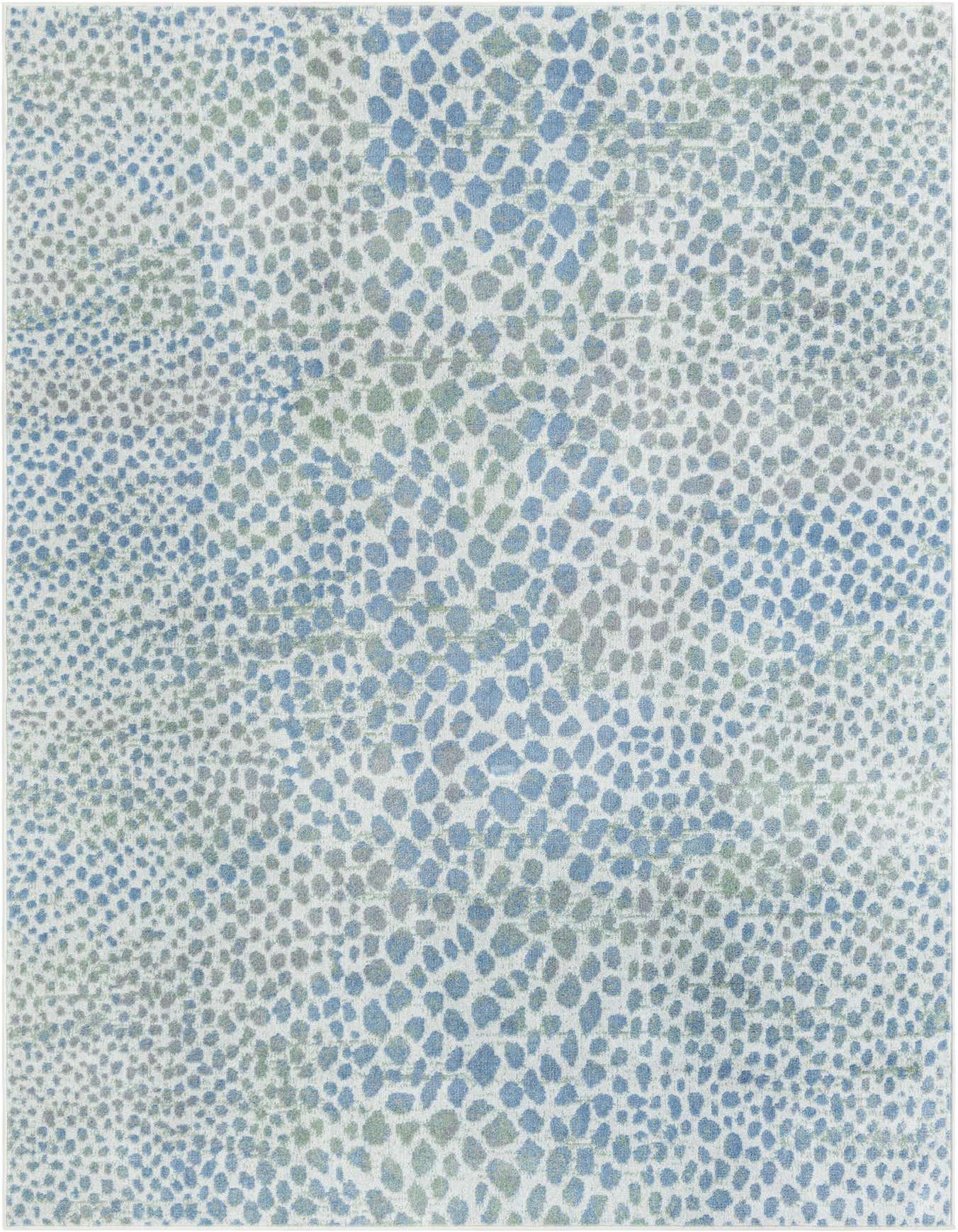A 6x9 rectangular Kamala Washable rug featuring an abstract pattern of blue, ivory, and cream speckles.