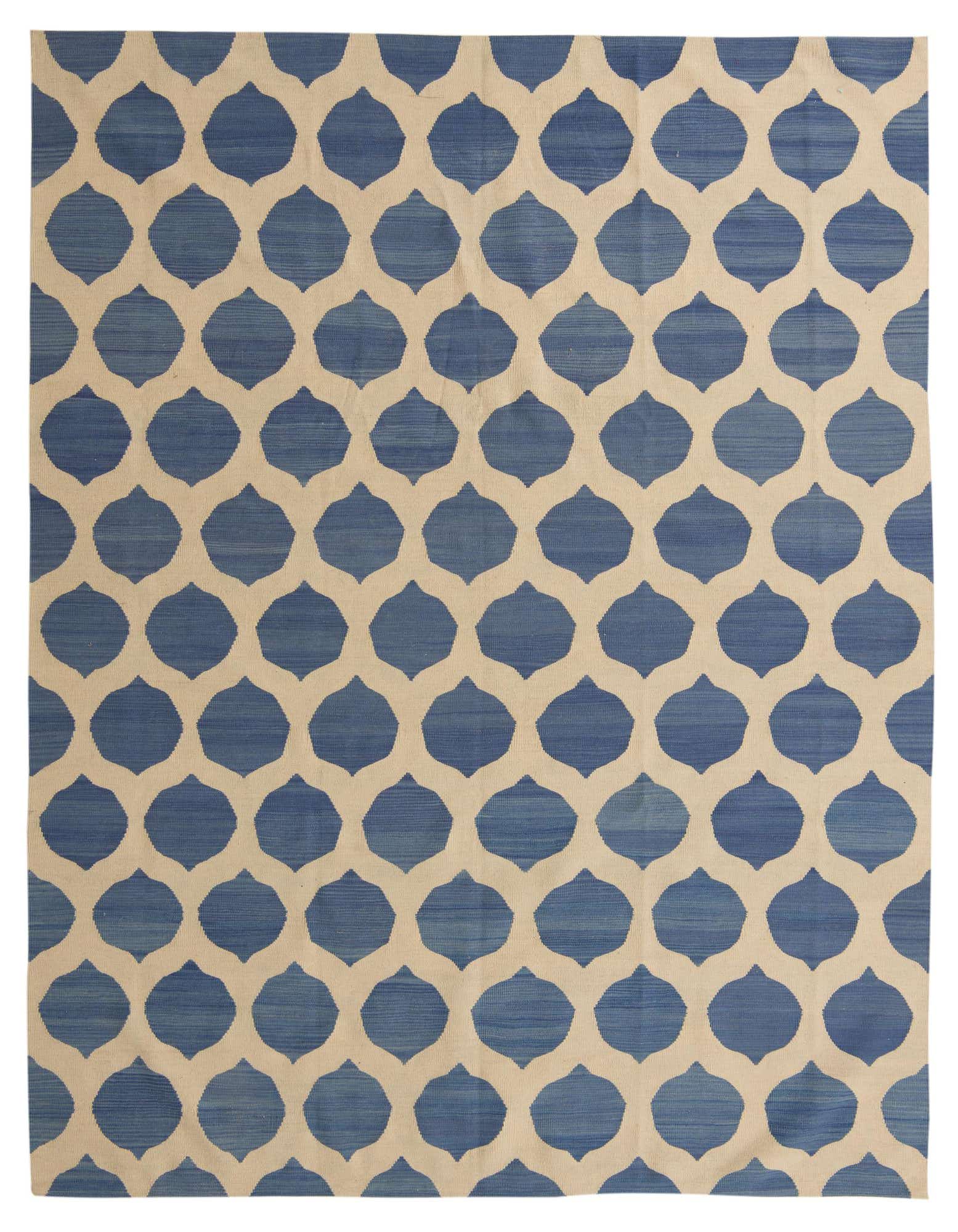 An 8x10 rectangular blue and ivory flatweave rug with a modern tribal ogee pattern, suitable for a living room.