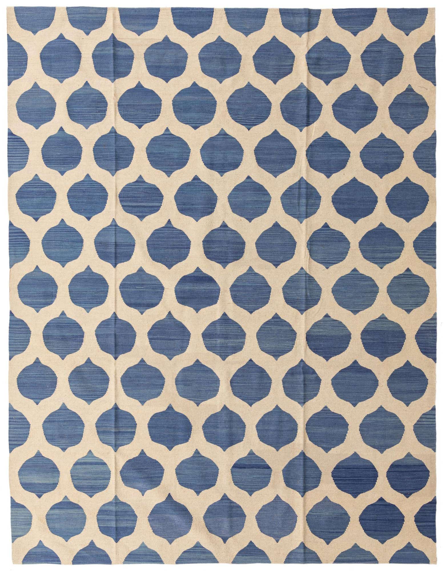 A rectangular 8x10 Kilim Modern wool rug featuring a bold blue and ivory tribal geometric pattern, suitable for a living room.
