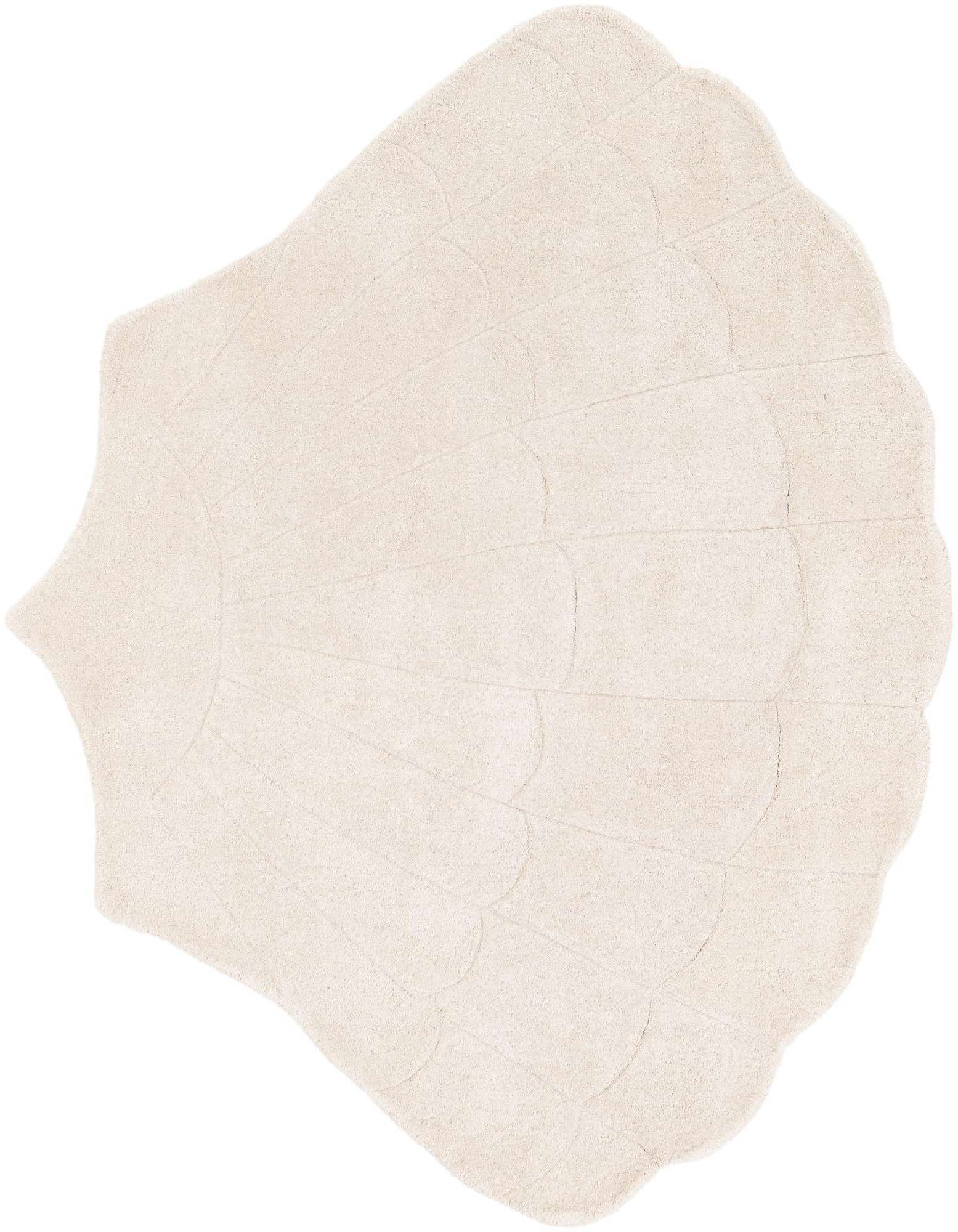 A plush, freeform ivory wool rug shaped like a seashell, featuring textured lines that mimic a shell's natural ridges.