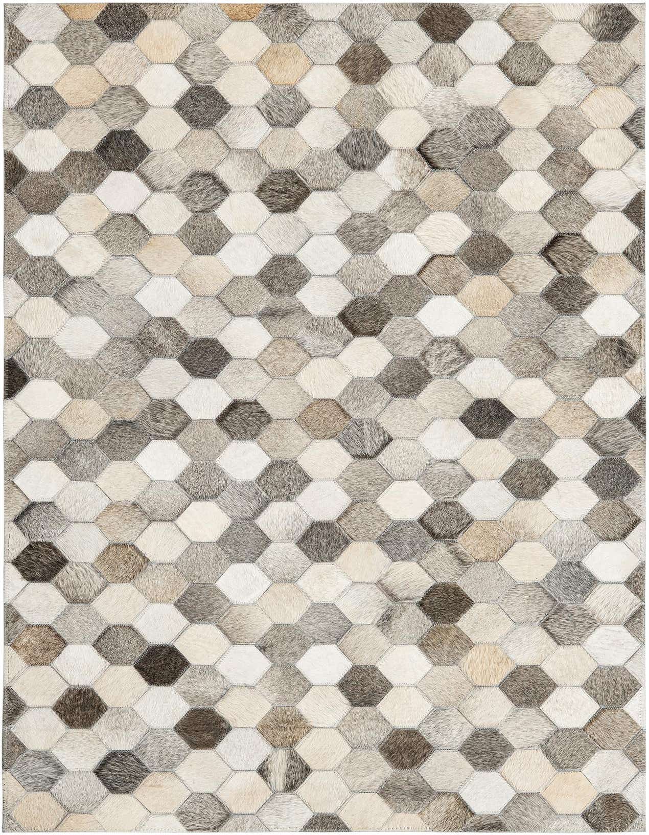 A 3x5 rectangular modern cowhide rug featuring a patchwork of hexagonal shapes in varying shades of ivory, cream, gray, and white.