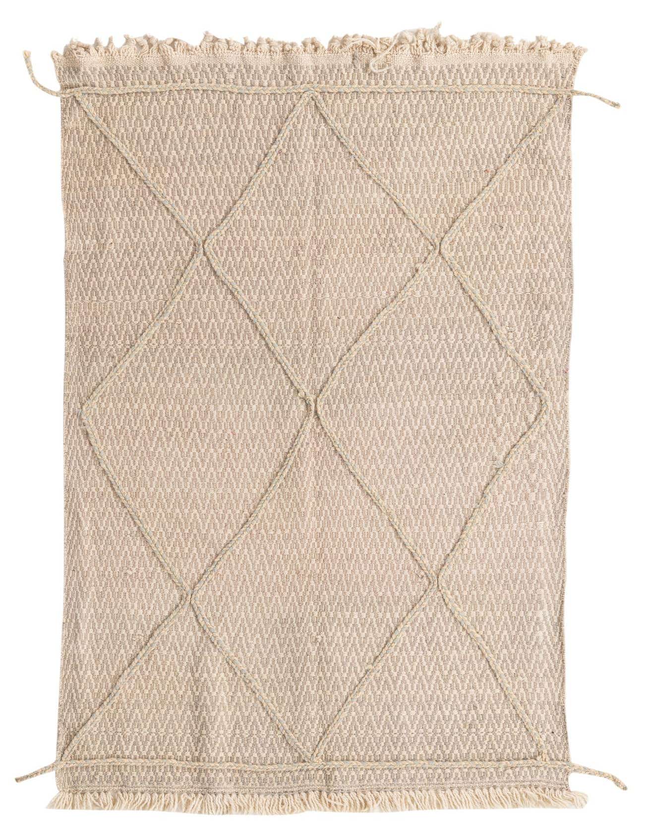 A 4x6 rectangular ivory wool shag rug with a modern tribal diamond pattern, perfect for a living room.