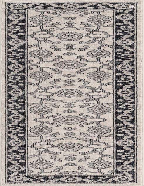 An 8 ft runner rug from the Eco Traditional collection, featuring a cream background with gray and black traditional floral patterns and a dark border, perfect for a hallway or kitchen.