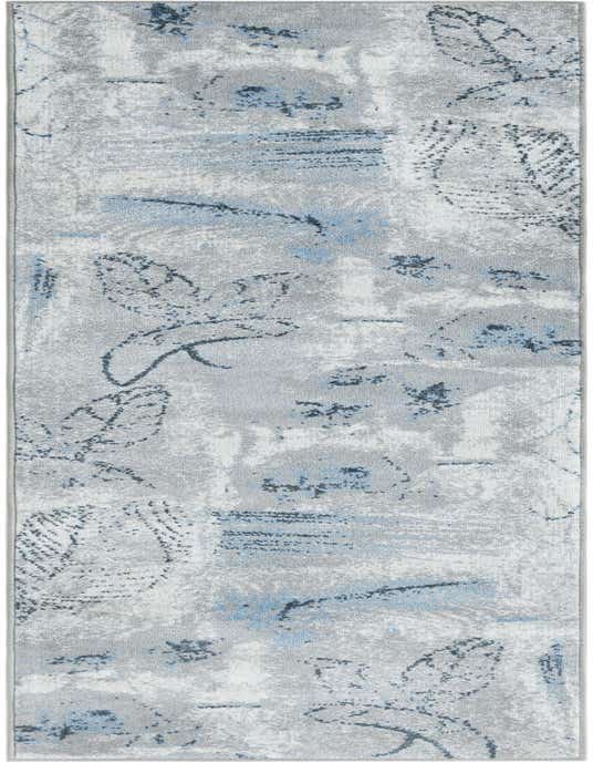 An 8 ft runner rug with an abstract coastal pattern in shades of ivory, cream, gray, and light blue, featuring subtle leaf-like motifs.