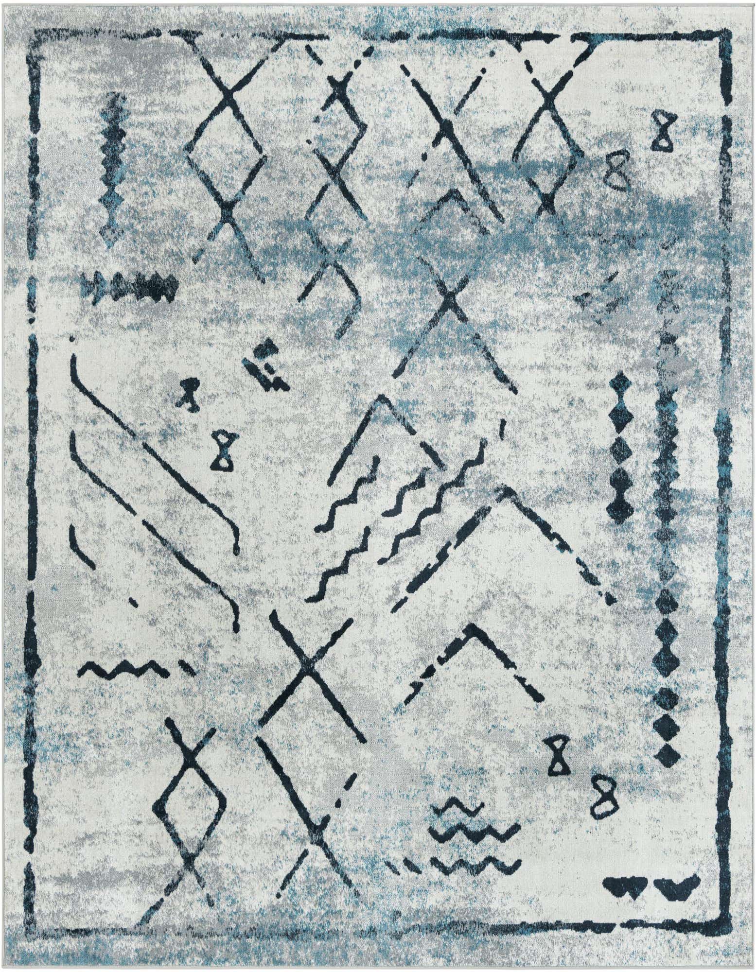 A square 7' 10 x 7' 10 Kamala Washable rug featuring a distressed ivory and gray background with tribal-inspired patterns in dark blue and black.