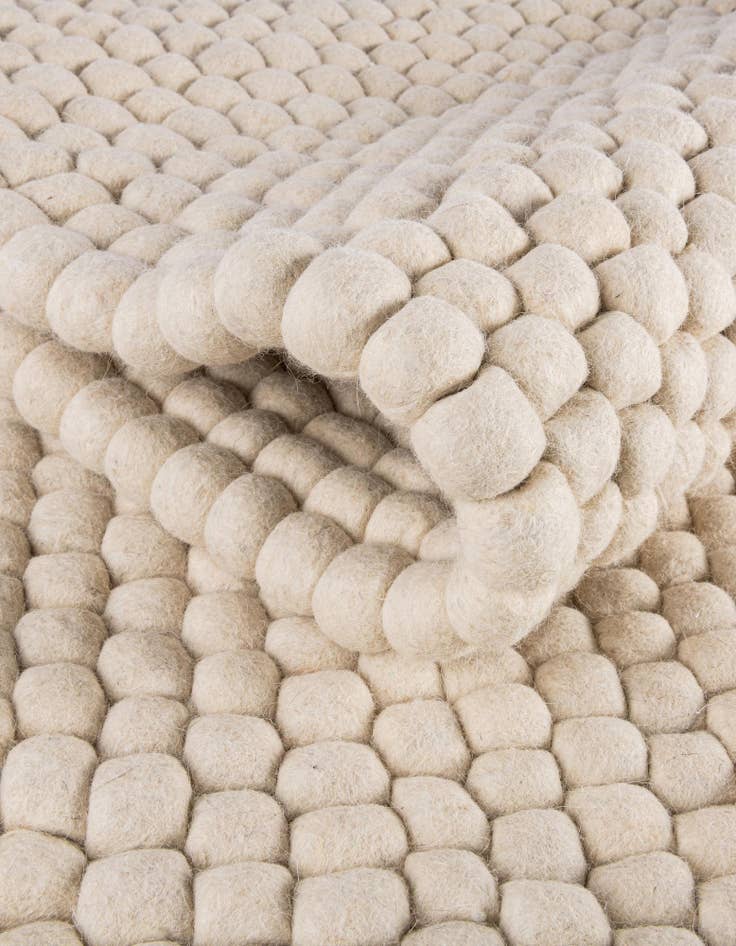 Detail image of  2' 2 x 3' 7  Hand Woven Felt Ball Wool Hearth Rug