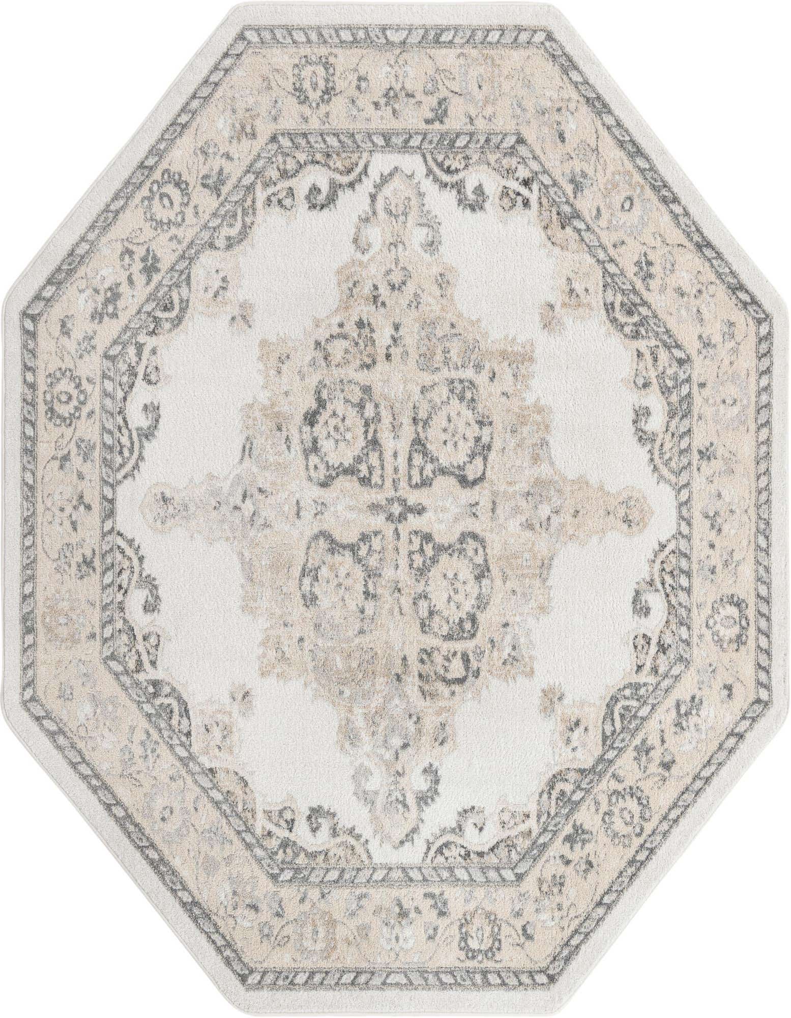 An octagonal ivory and cream rug with a traditional botanical medallion pattern in shades of gray and beige.