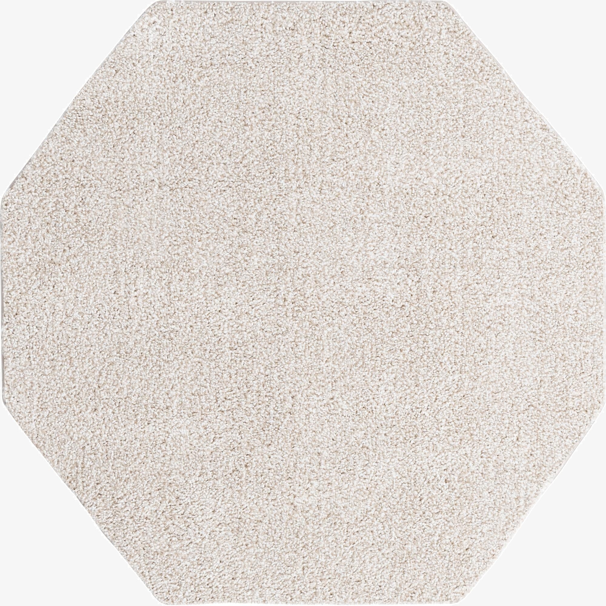 A 5' 0 x 5' 0 octagon ivory area rug with a textured, solid frieze pile, perfect for a modern living space.