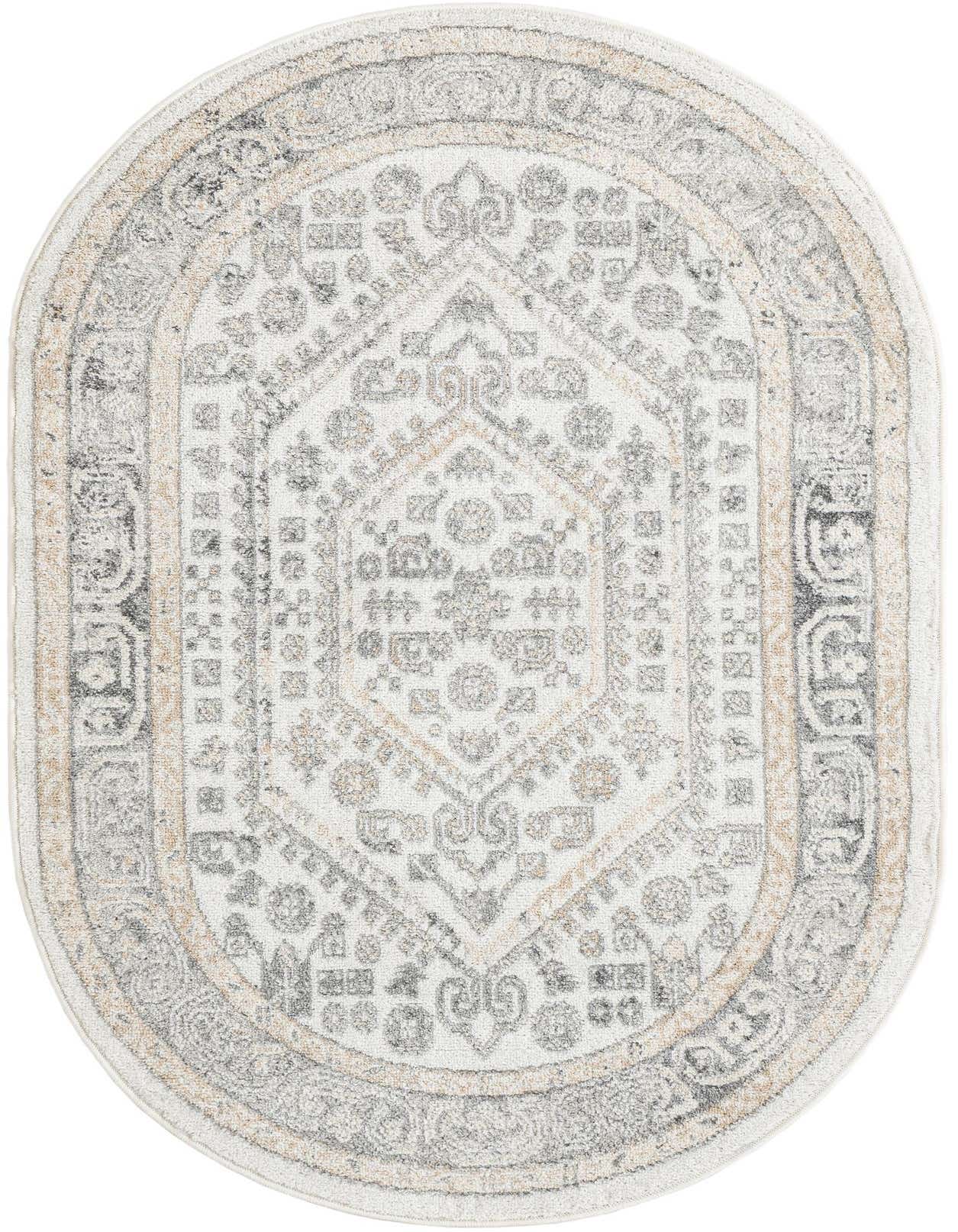 An oval ivory and cream rug with a distressed traditional medallion pattern in grey and light gold, suitable for an indoor living space.