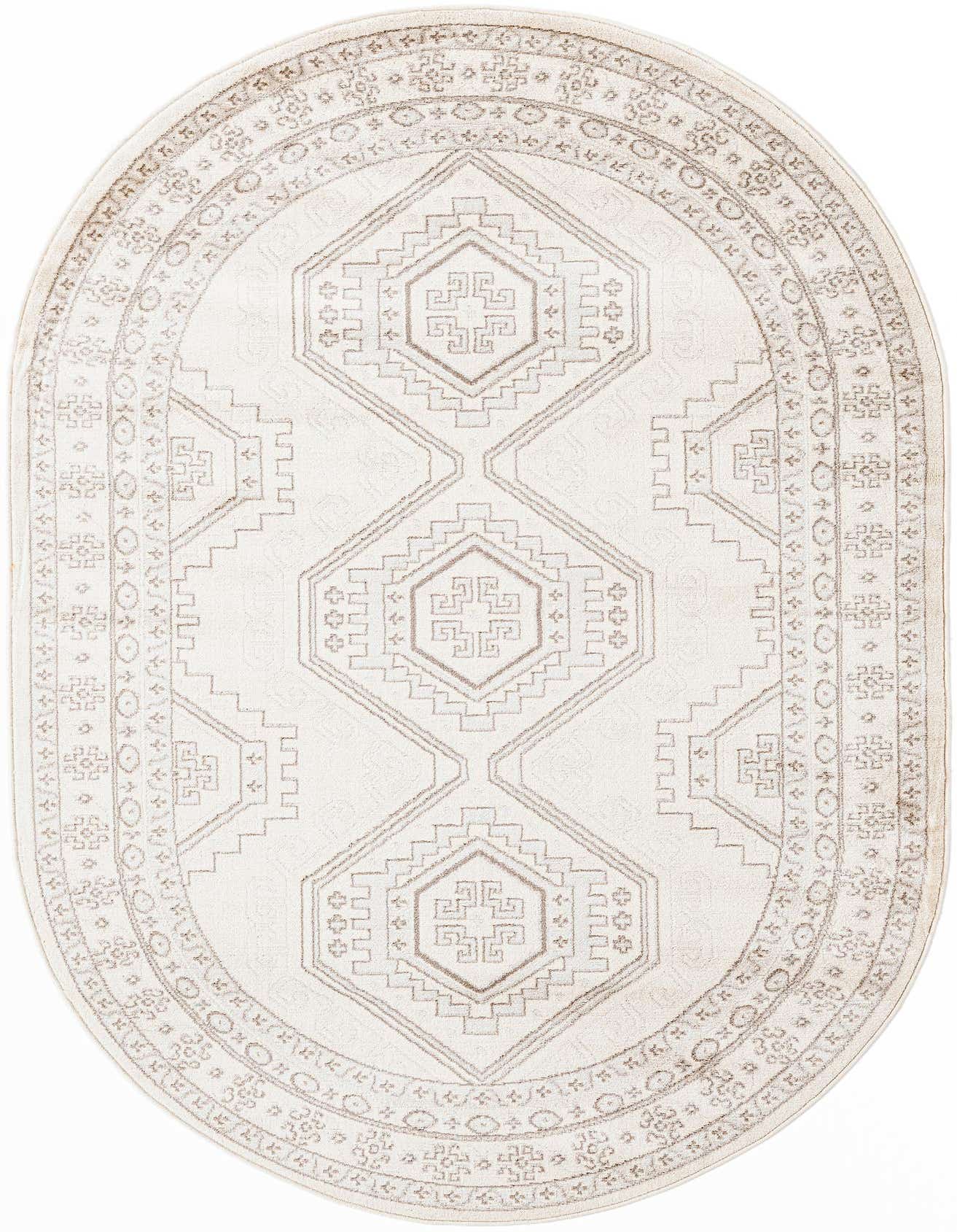 An oval ivory and cream rug with a traditional tribal pattern featuring geometric shapes and a decorative border.