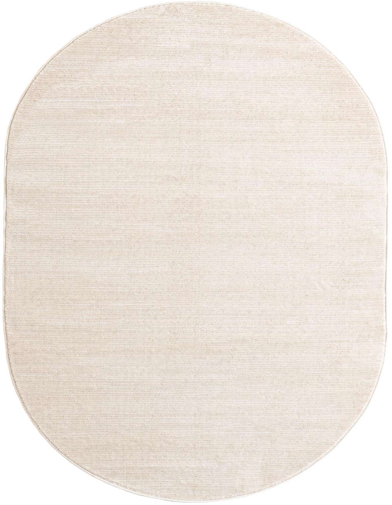 A 4'x6' oval ivory area rug with a subtle textured high-low pile, perfect for a modern living space.