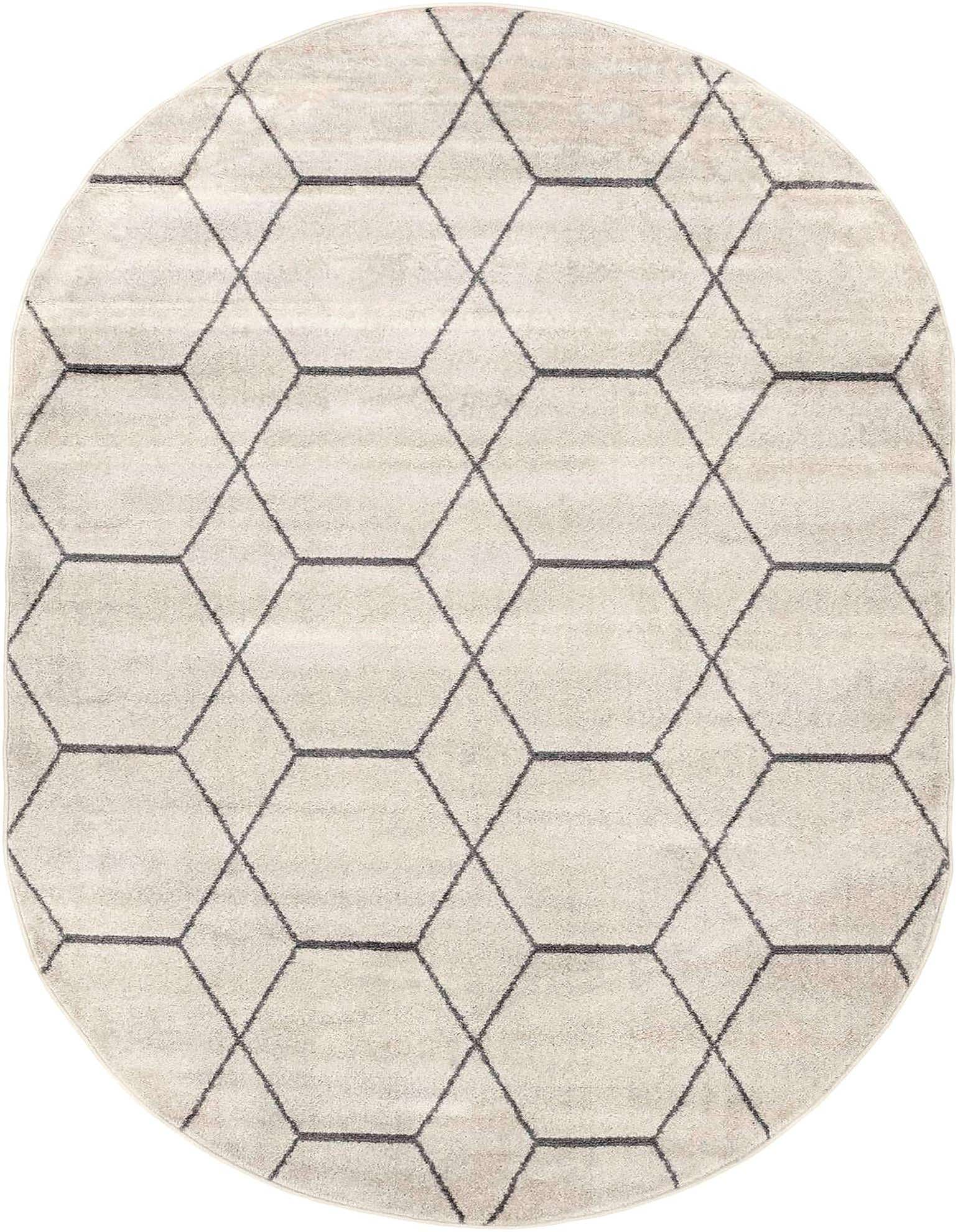 An oval ivory and cream modern rug with a dark gray geometric trellis pattern, ideal for an indoor space.