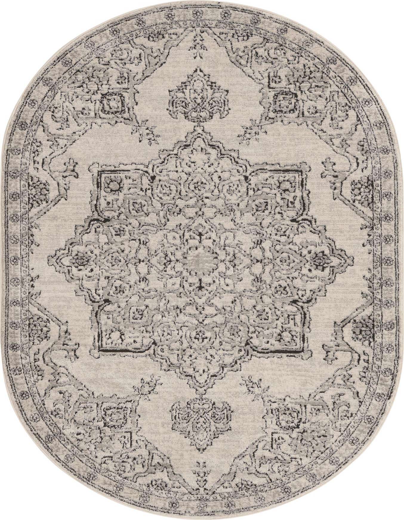 An oval 5' 3 x 8' 0 ivory and cream rug with a traditional medallion pattern and vintage distressed look.