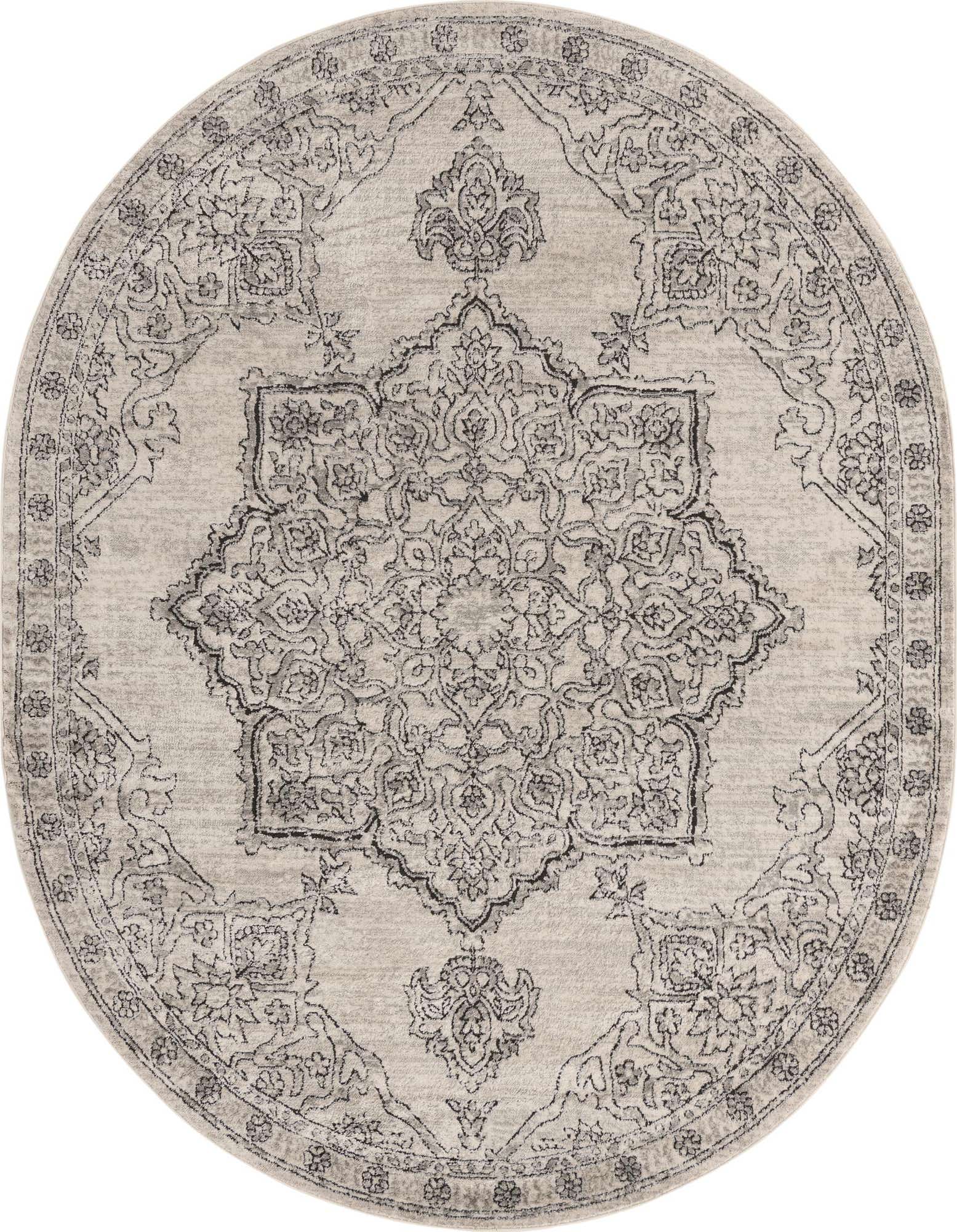 An oval 7' 10 x 10' 0 ivory and cream traditional medallion rug with a textured pile.