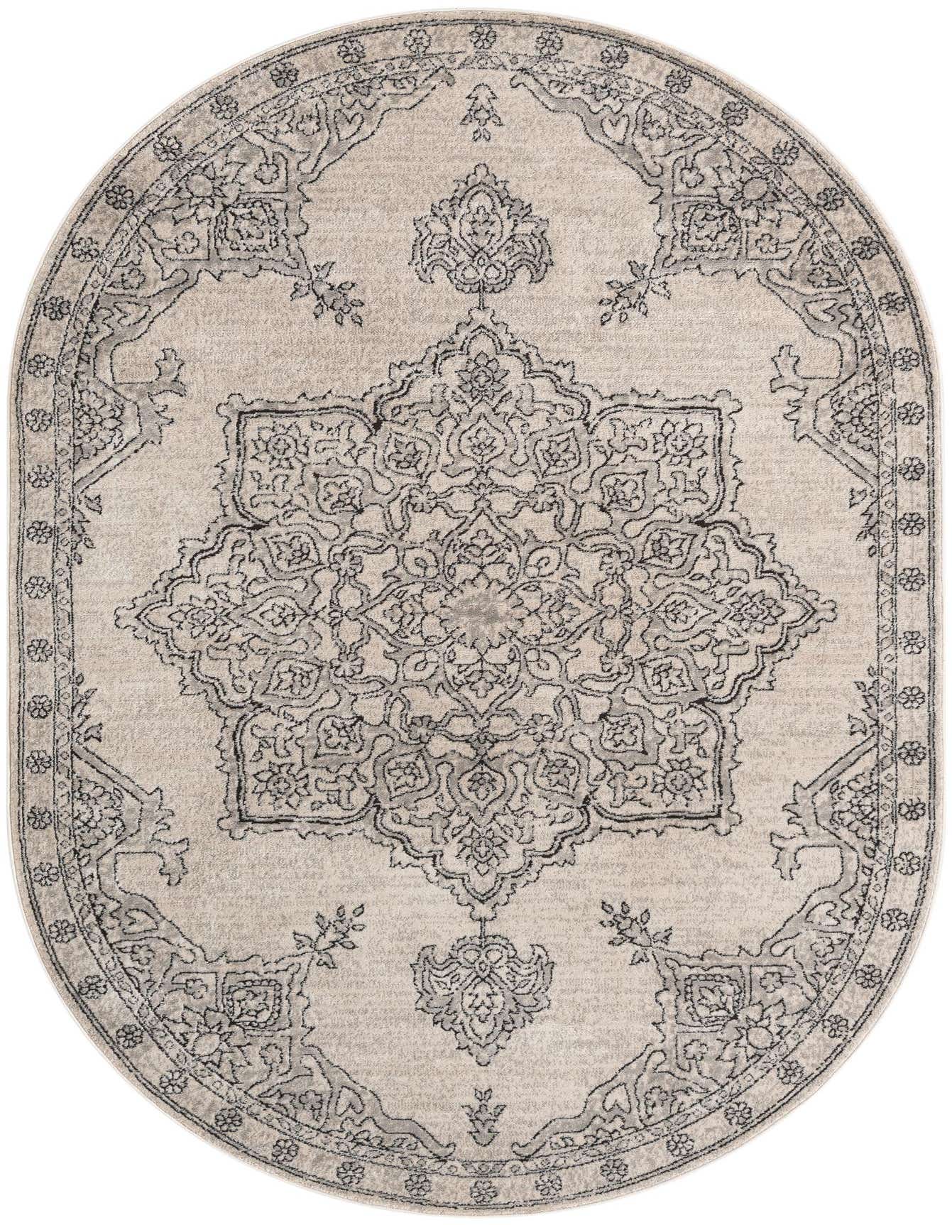 An oval ivory and cream rug with a detailed gray and black medallion pattern, suitable for a living room or patio.