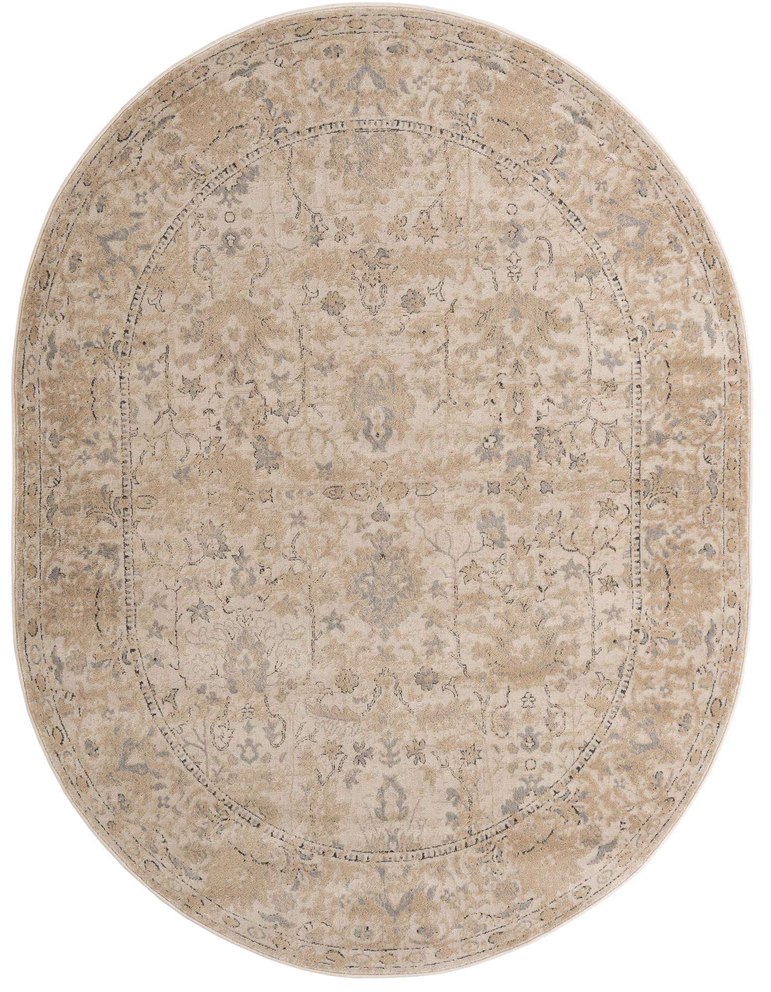 An oval 7' 10 x 10' 0 ivory and cream rug with a distressed traditional floral pattern and a textured pile.