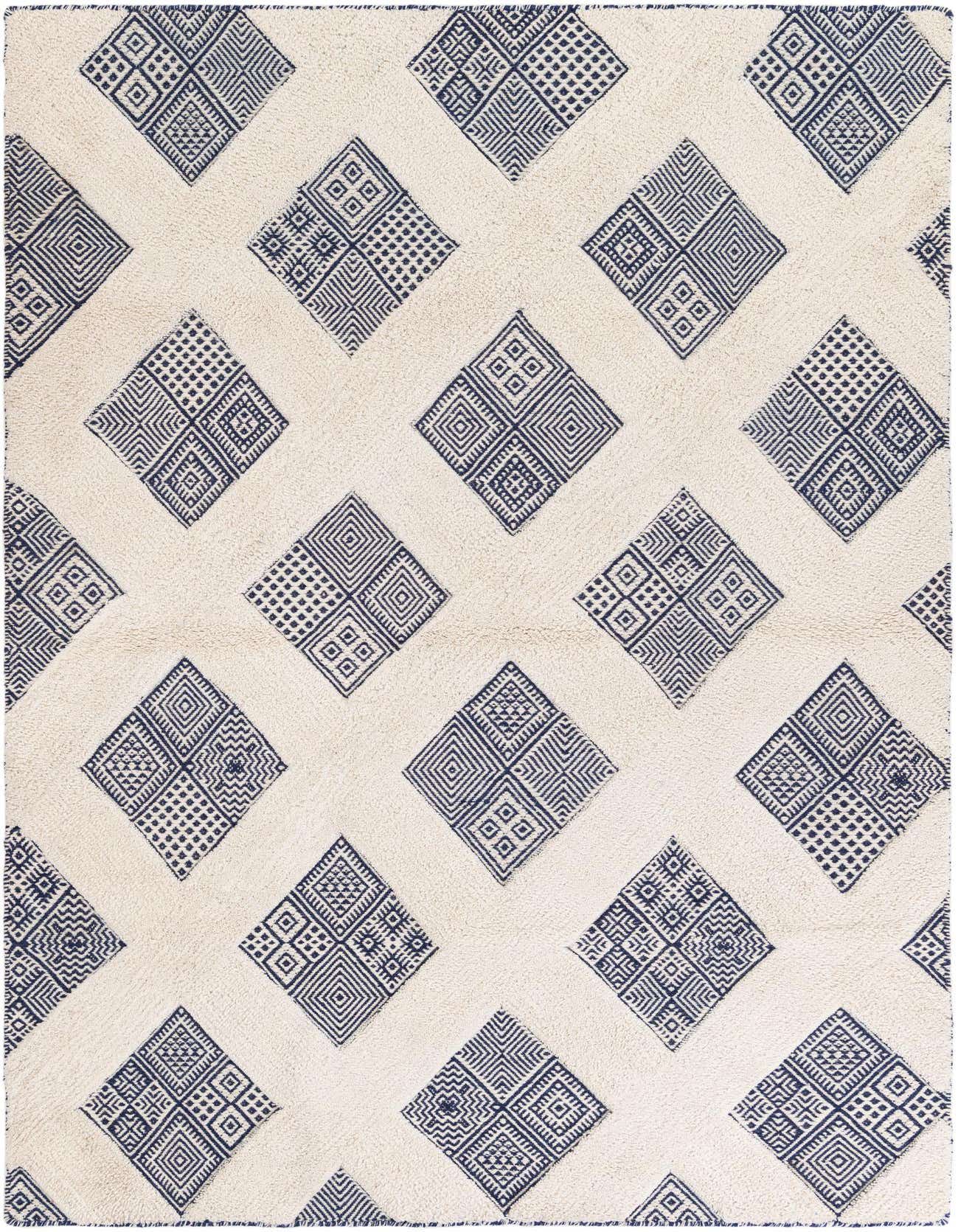 A 5x8 rectangular ivory modern wool rug with a pattern of large navy blue geometric diamonds.